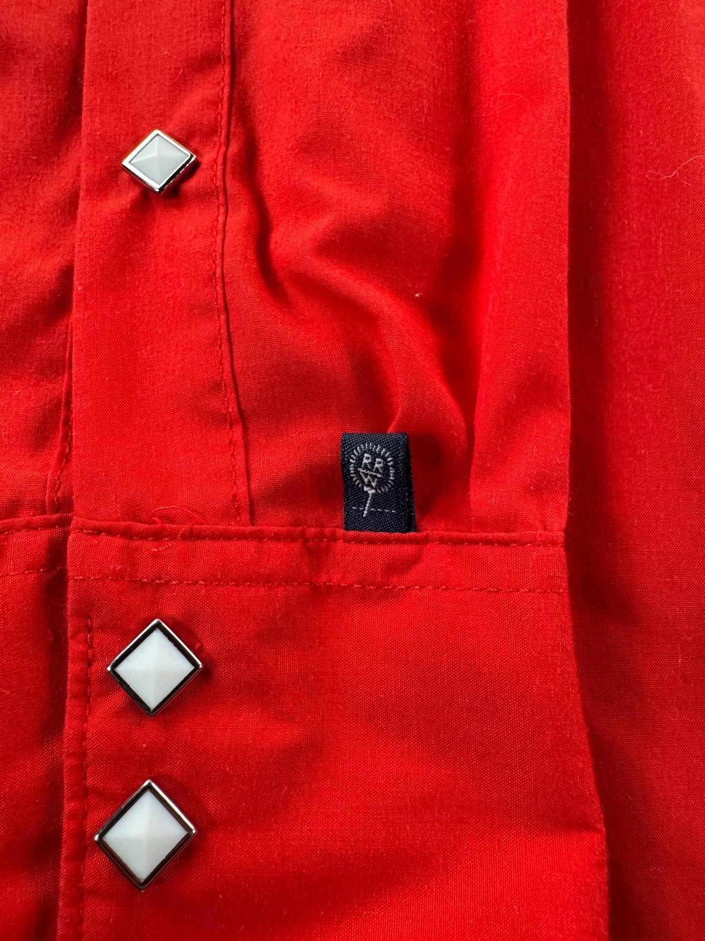 Label on Vintage Rockmount Red Sawtooth Pearl Snap SZ L