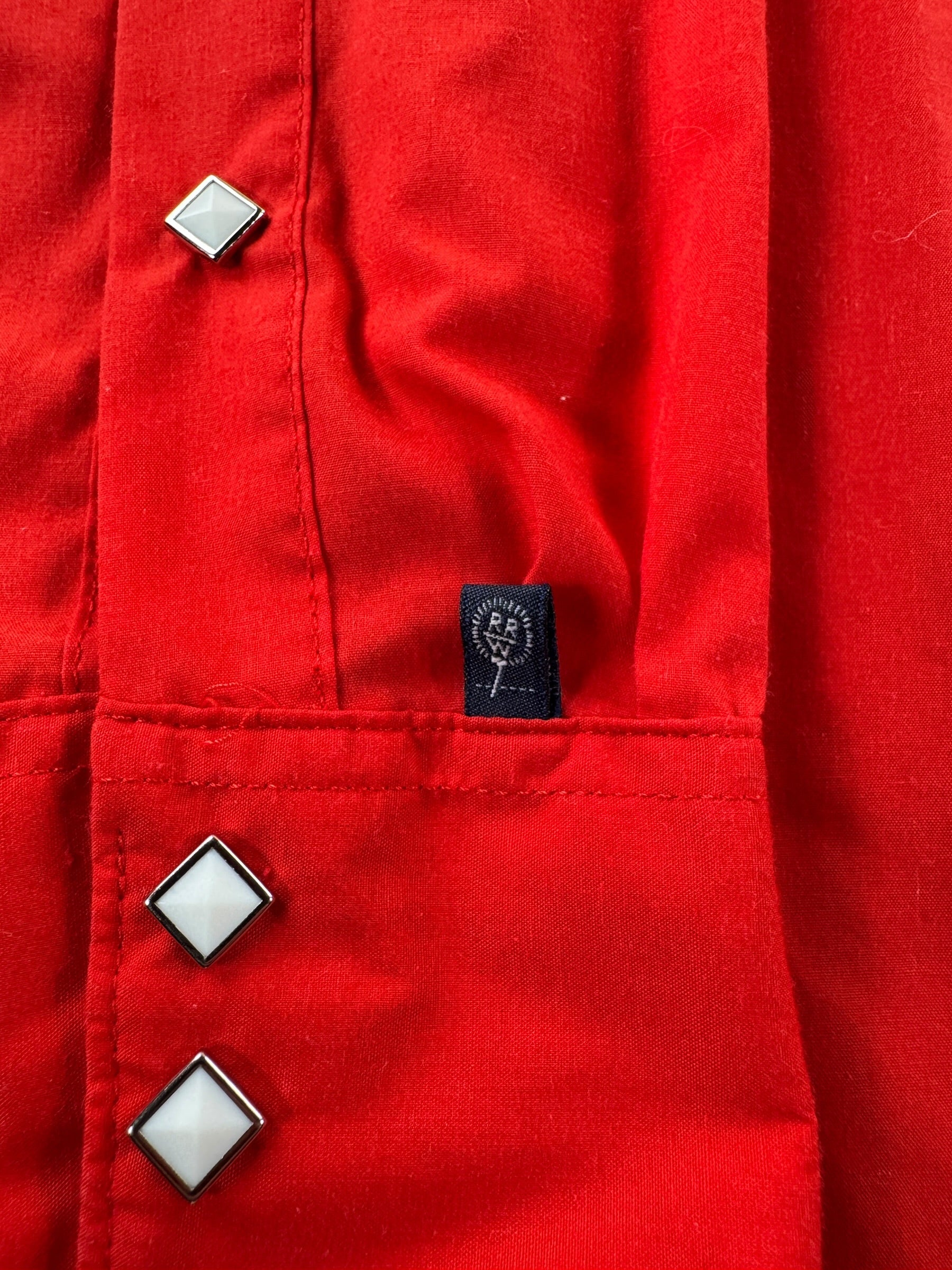 Label on Vintage Rockmount Red Sawtooth Pearl Snap SZ L