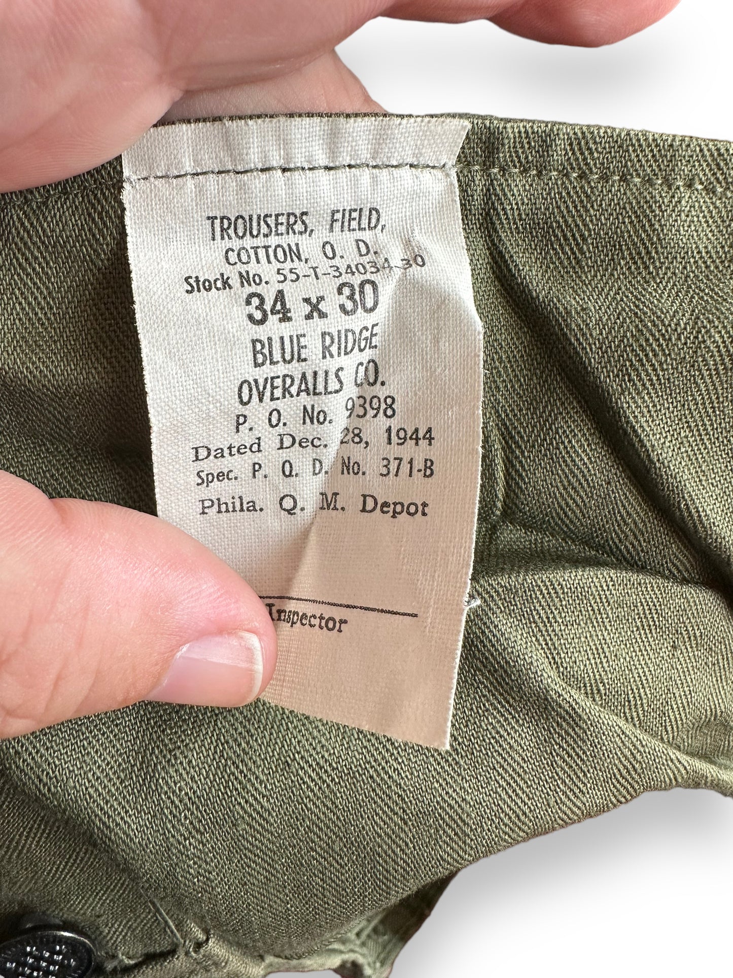 Production Tag on Vintage WWII M-43 HBT Field Cotton Trousers Olive Drab W34 | Barn Owl Vintage Seattle | Vintage Military Trousers Seattle