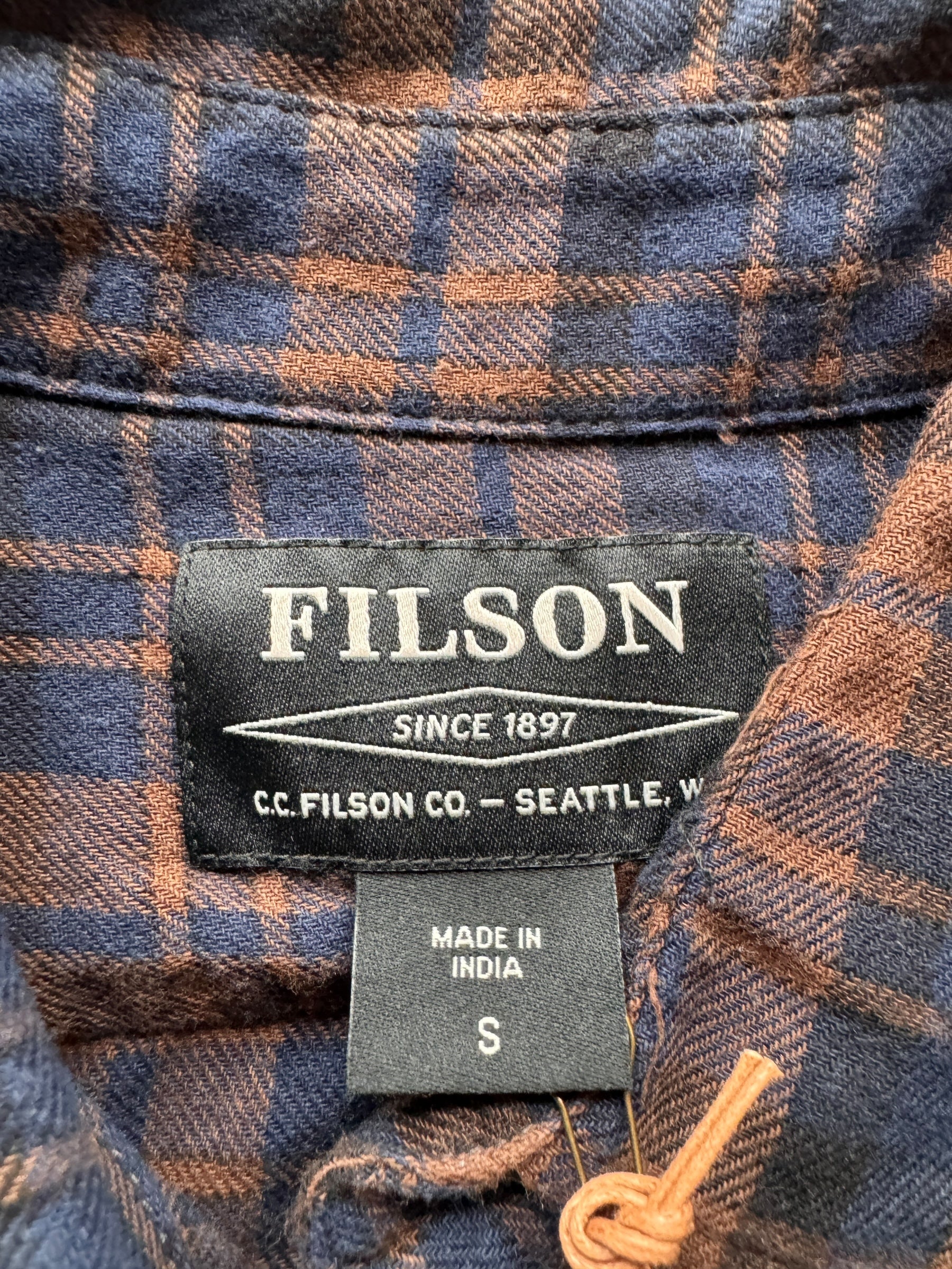 Tag on NOS Filson Brown Navy Black Scout Shirt SZ S