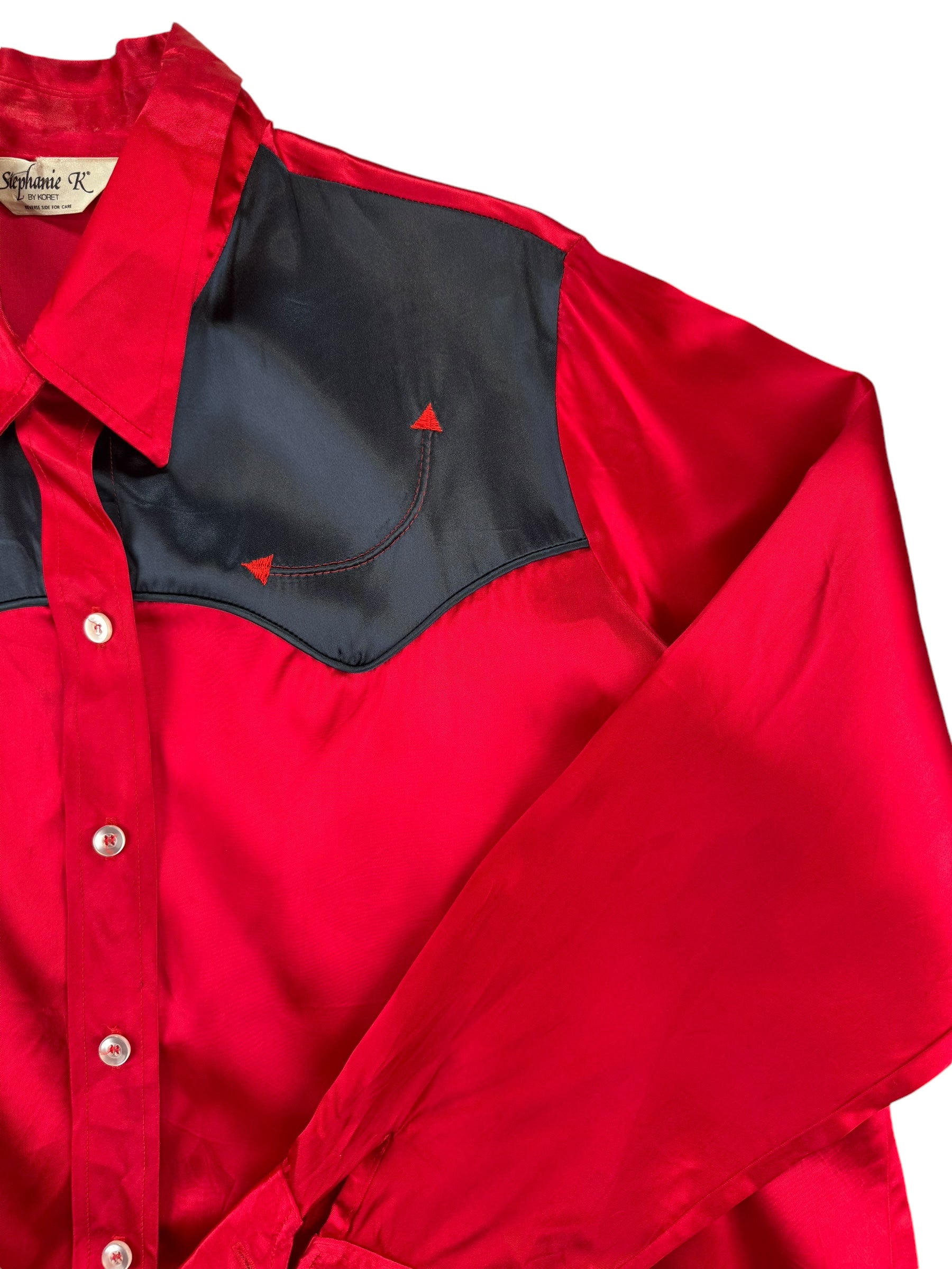 Front left shoulder of 1980s Red and Black Satin Western Pearl Snap Shirt XL