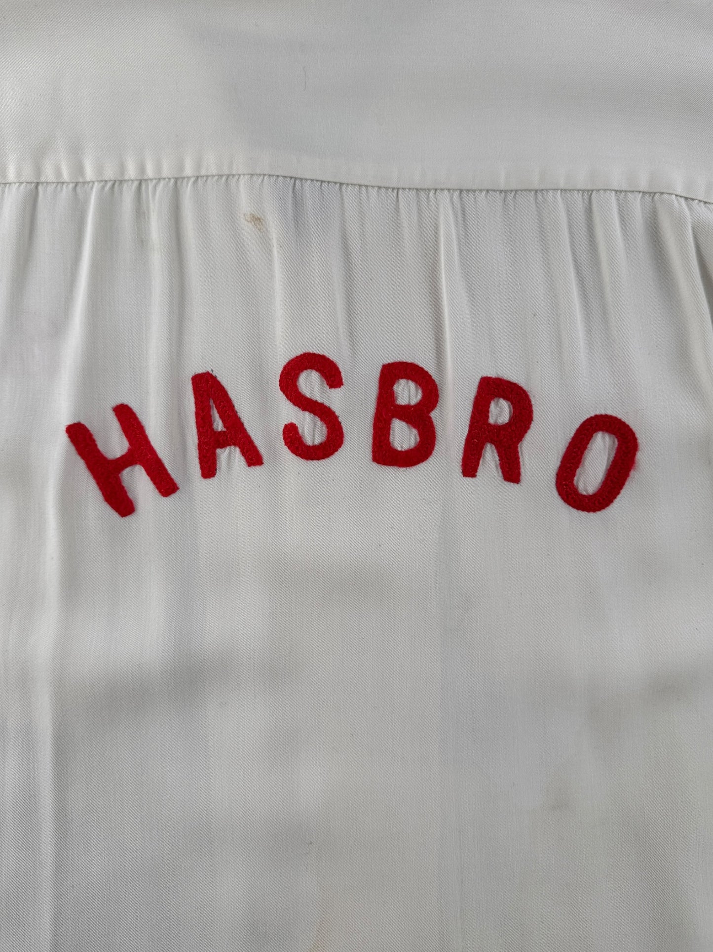 Chainstitched Hasbro logo on back of Vintage Hasbro Chain Stitched Rayon Bowling Shirt SZ L
