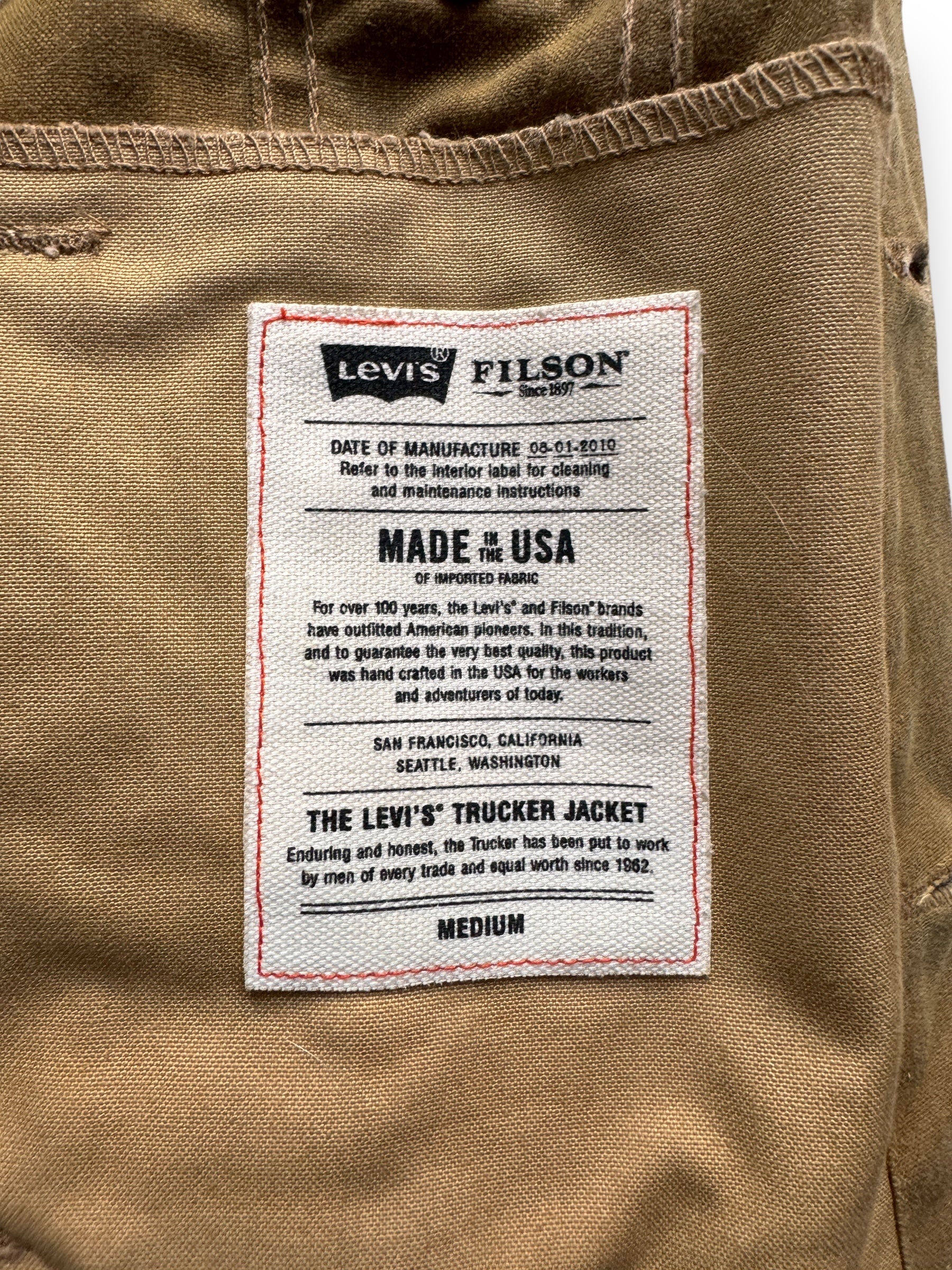 Sizing Tag on Filson X Levis Tin Cloth Type III Trucker Jacket SZ M