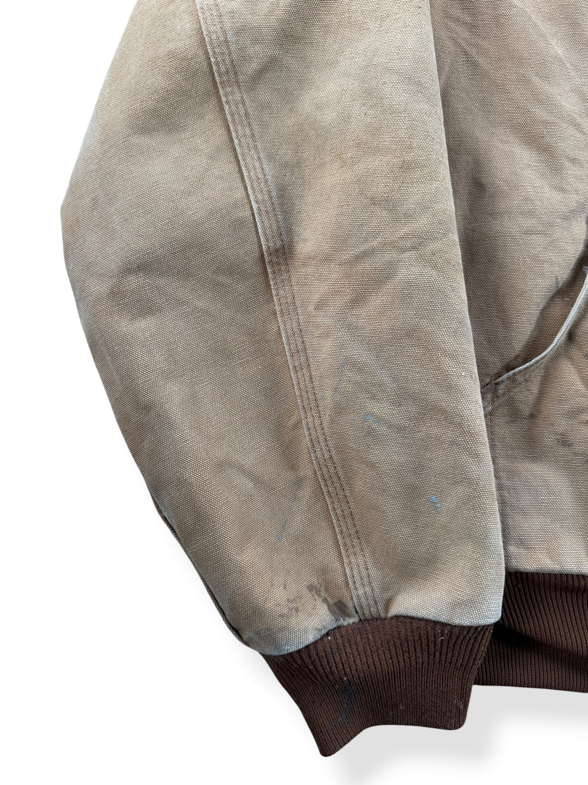 Ware on sleeve of Carhartt Tan Hooded Jacket SZ L