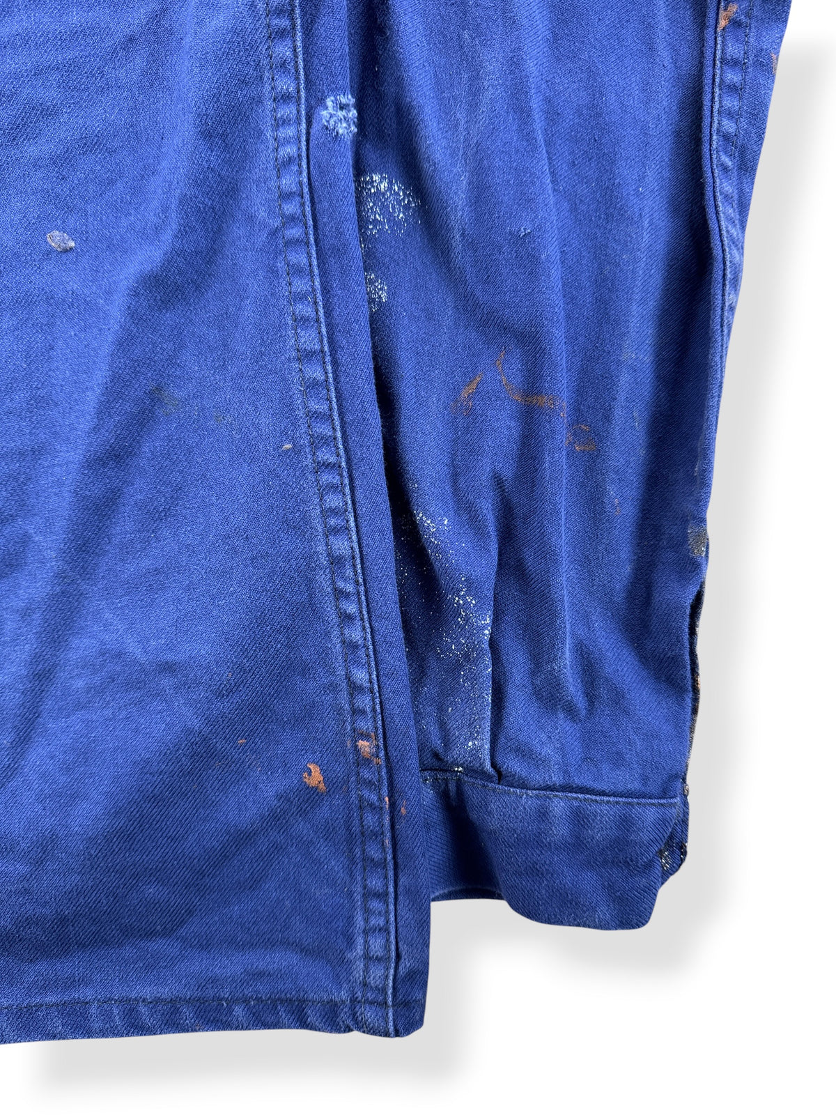Paint on back sleeve of Vintage Paint Splattered French Chore Coat SZ M