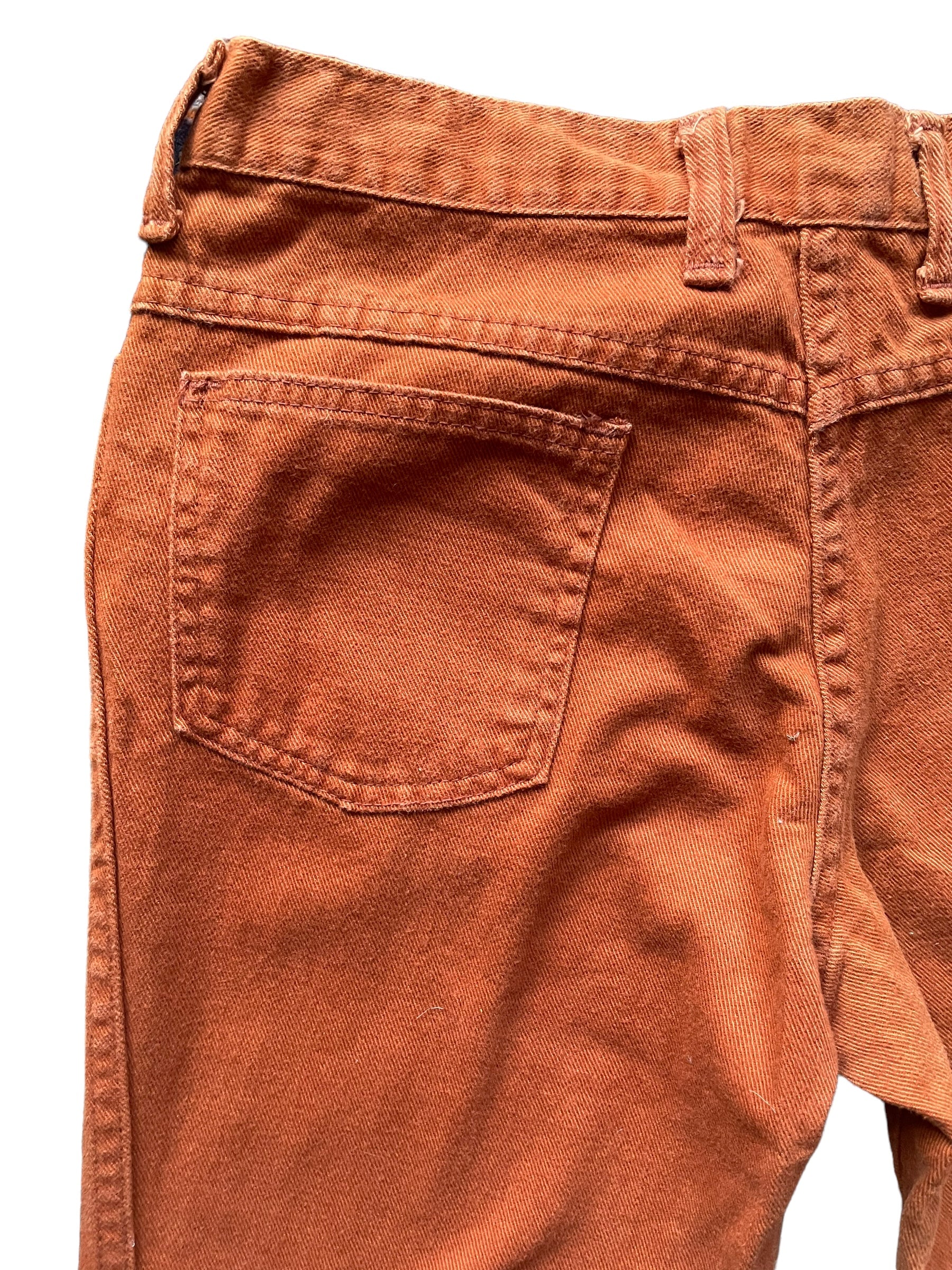 Left back pocket view of Vintage 1970s Rusty Orange Bells W30 | Barn Owl Vintage Seattle | Vintage Pants and Denim