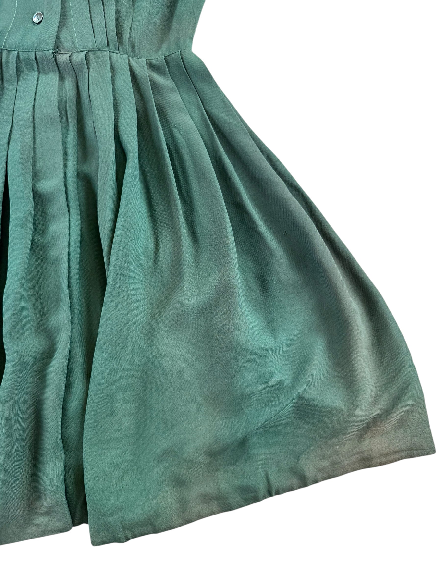 Front left side of skirt of 1940s Green Rayon Pleated Dress M