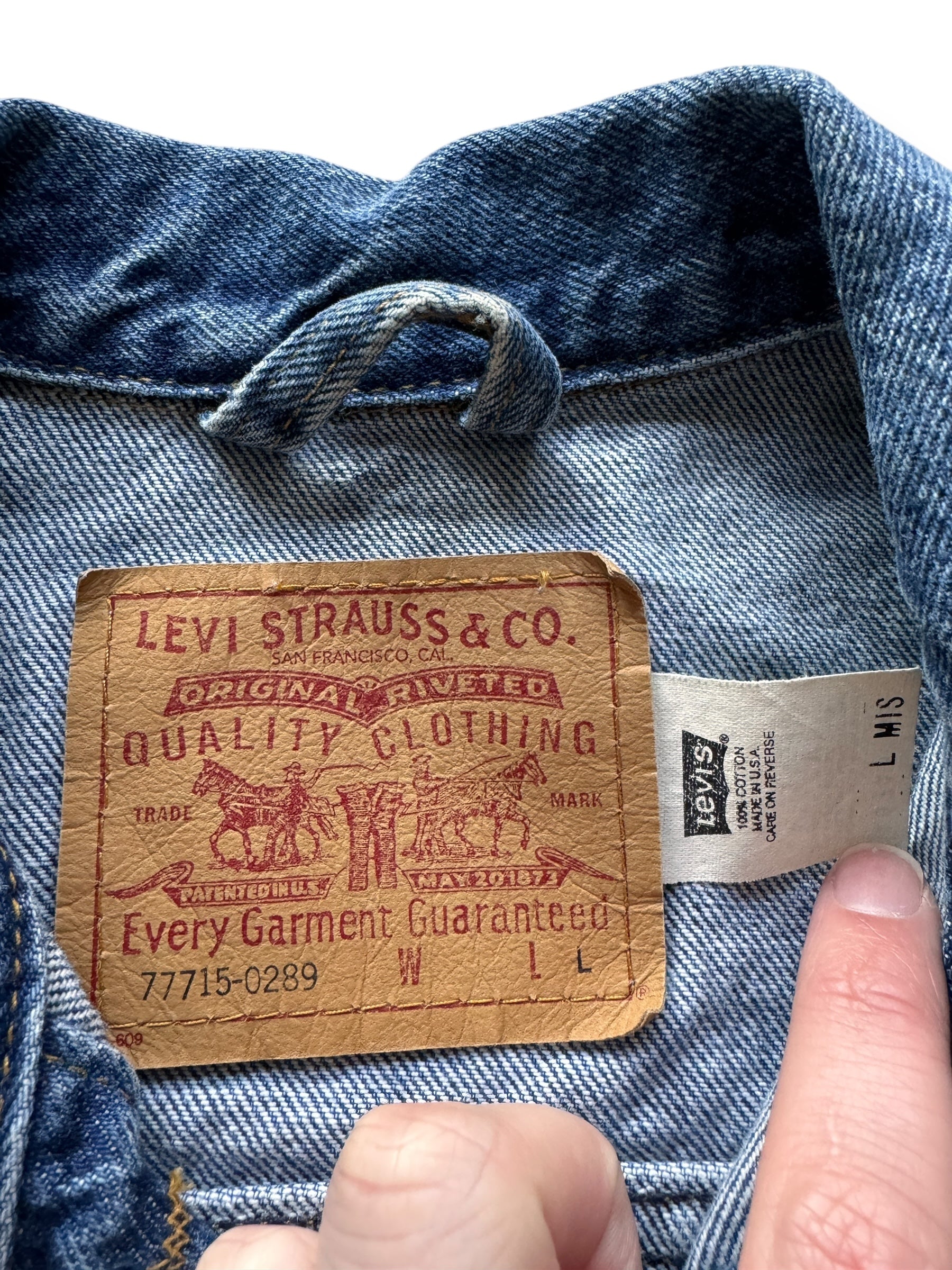 Tag on Vintage Ladies Made in the USA Levis 4-Pocket Trucker Jacket SZ L