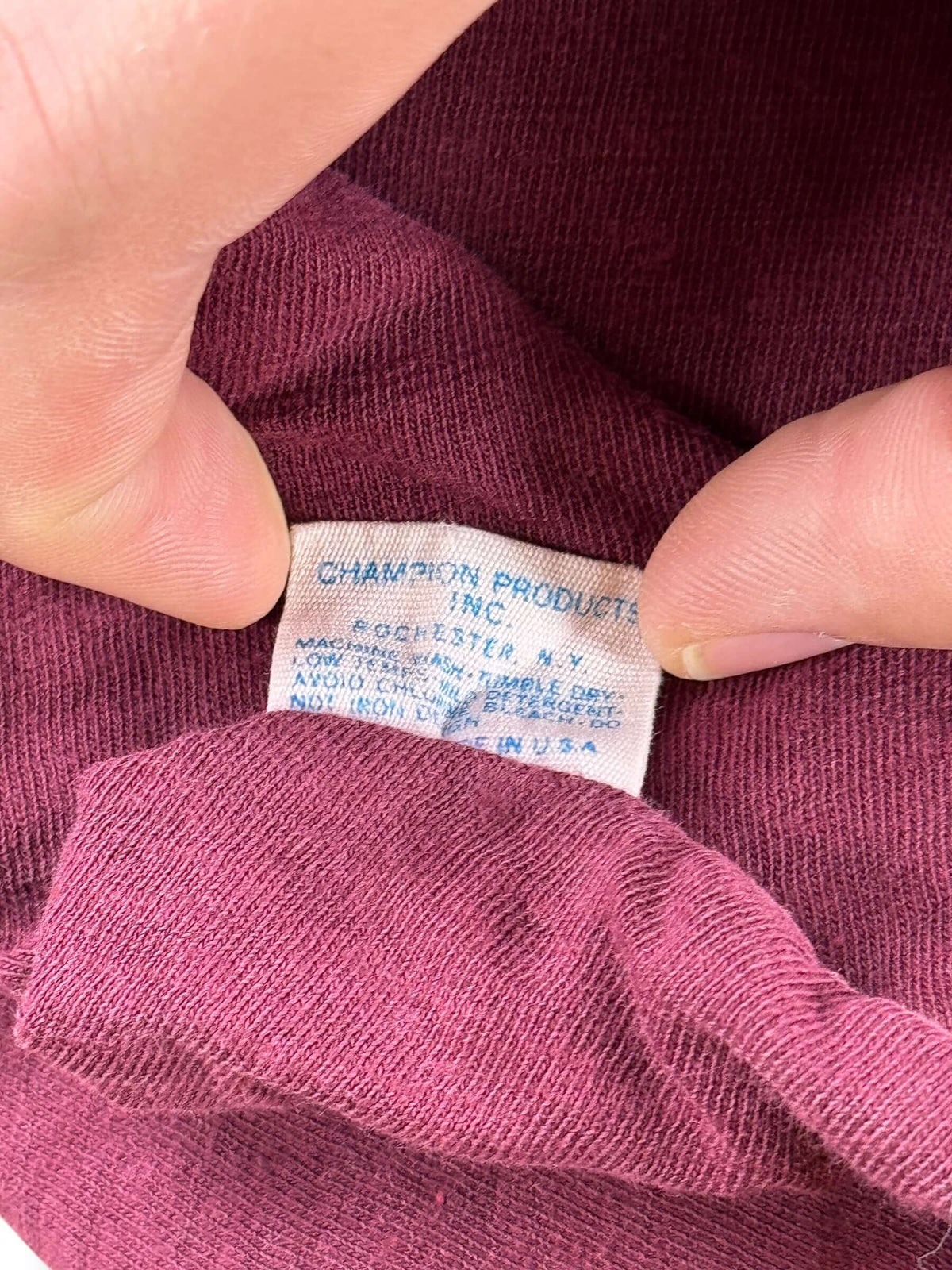 Back of size tag on Vintage Champion Blue Bar CMA Reversible Tee SZ L