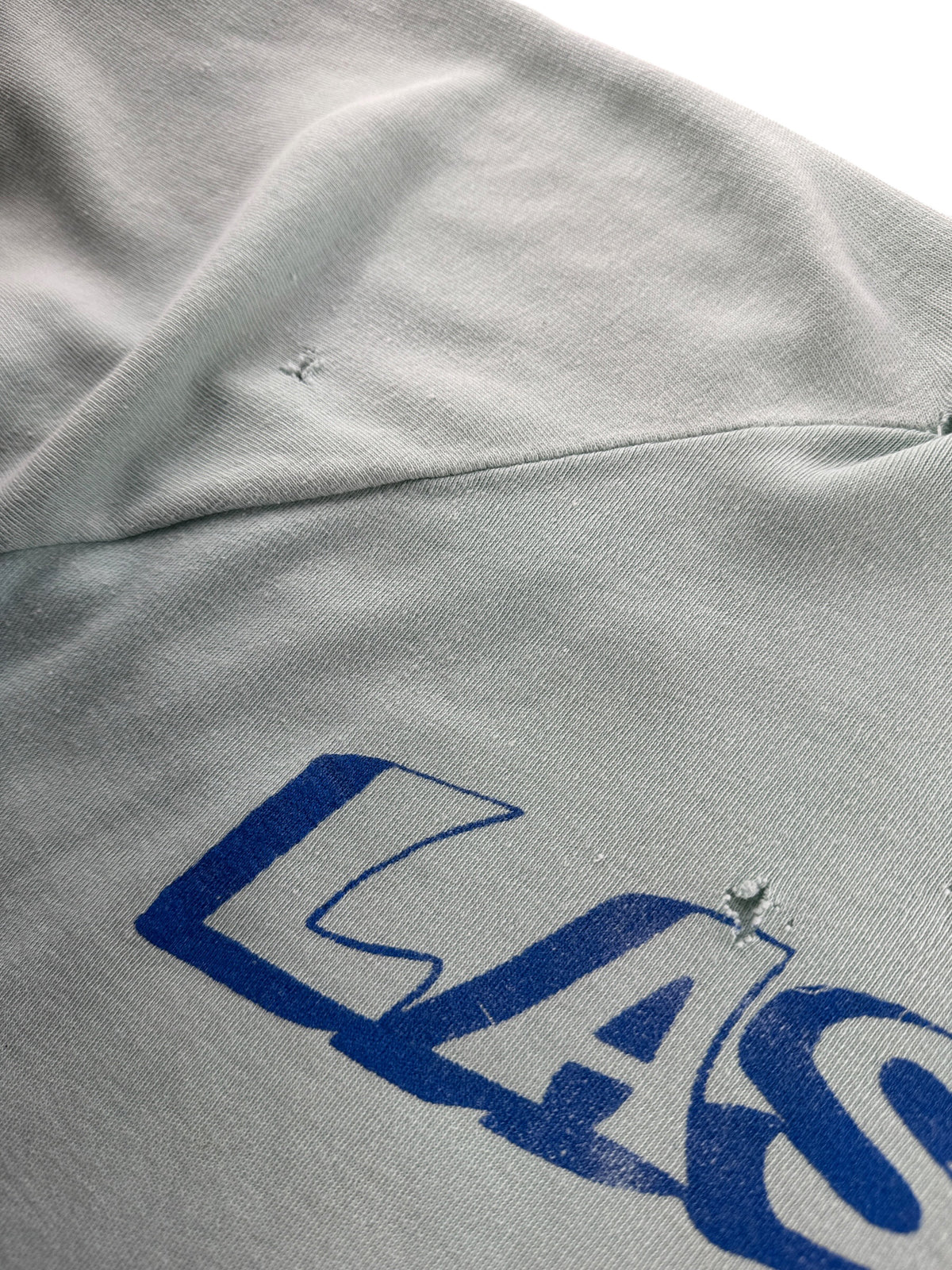 Holes near graphic on Vintage 70s Las Vegas Crewneck SZ L - AS IS