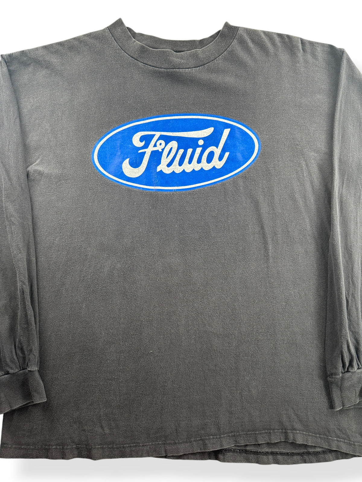 Close-up of Vintage 90s Fluid Volume Is Job 1 Tee SZ XL