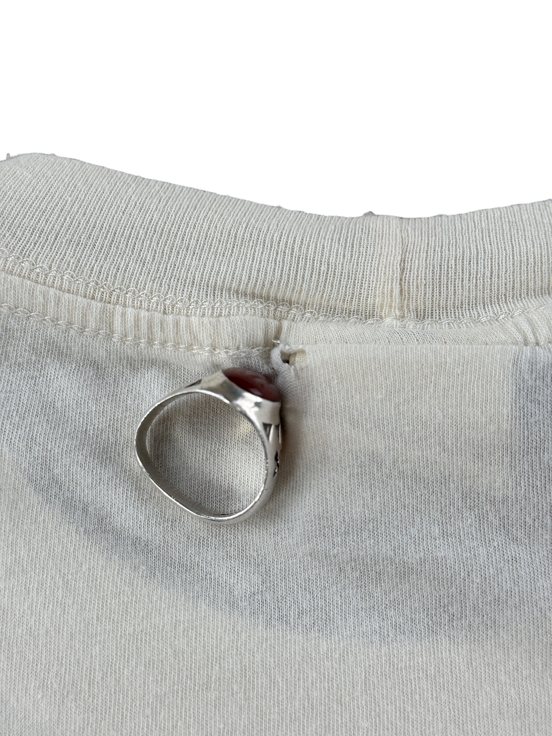 Small hole on back collar of Filson Popeye Tee SZ S