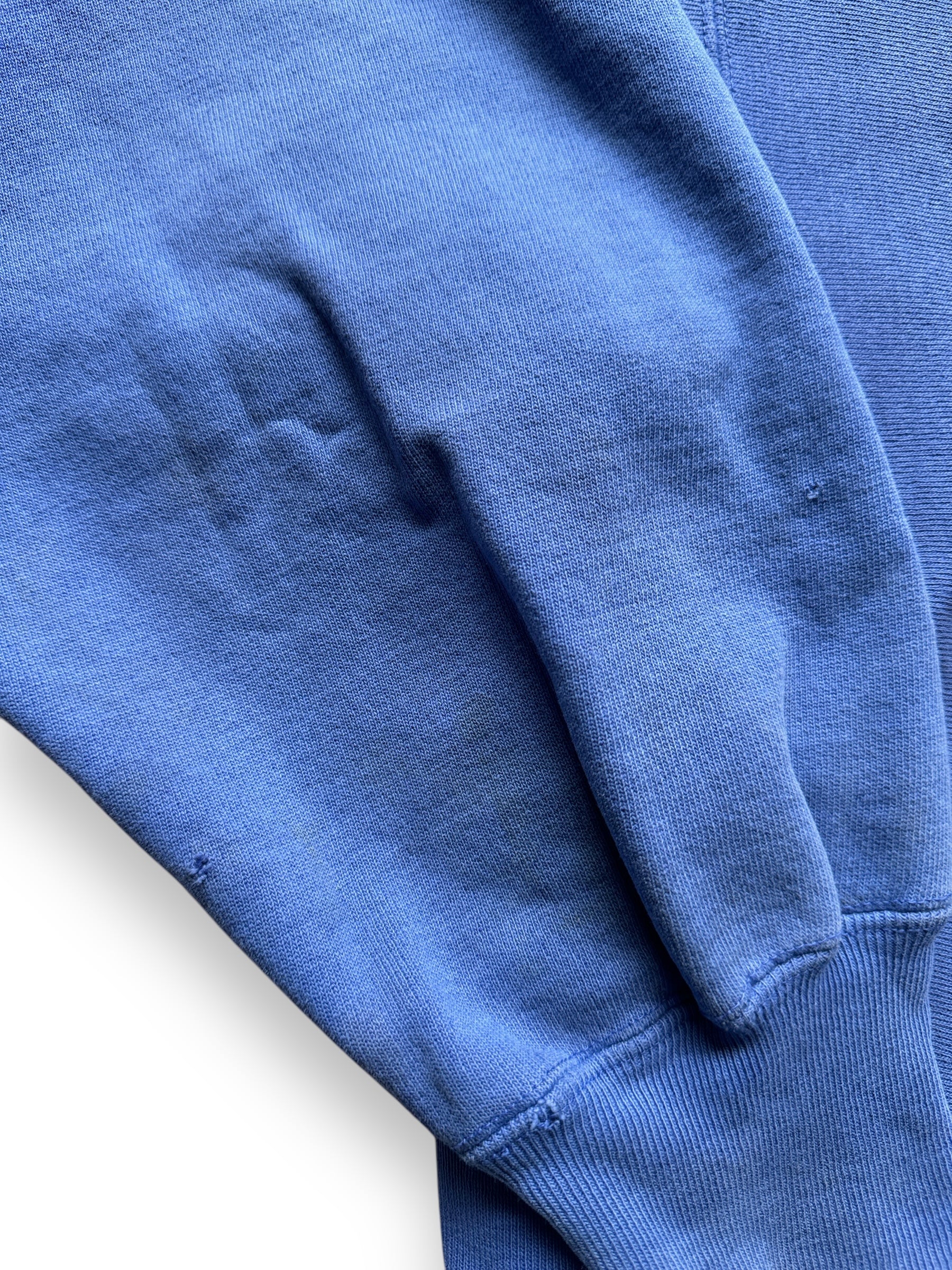 wear on right sleeve of Vintage Blue Blank Champion Reverse Weave Crewneck SZ L