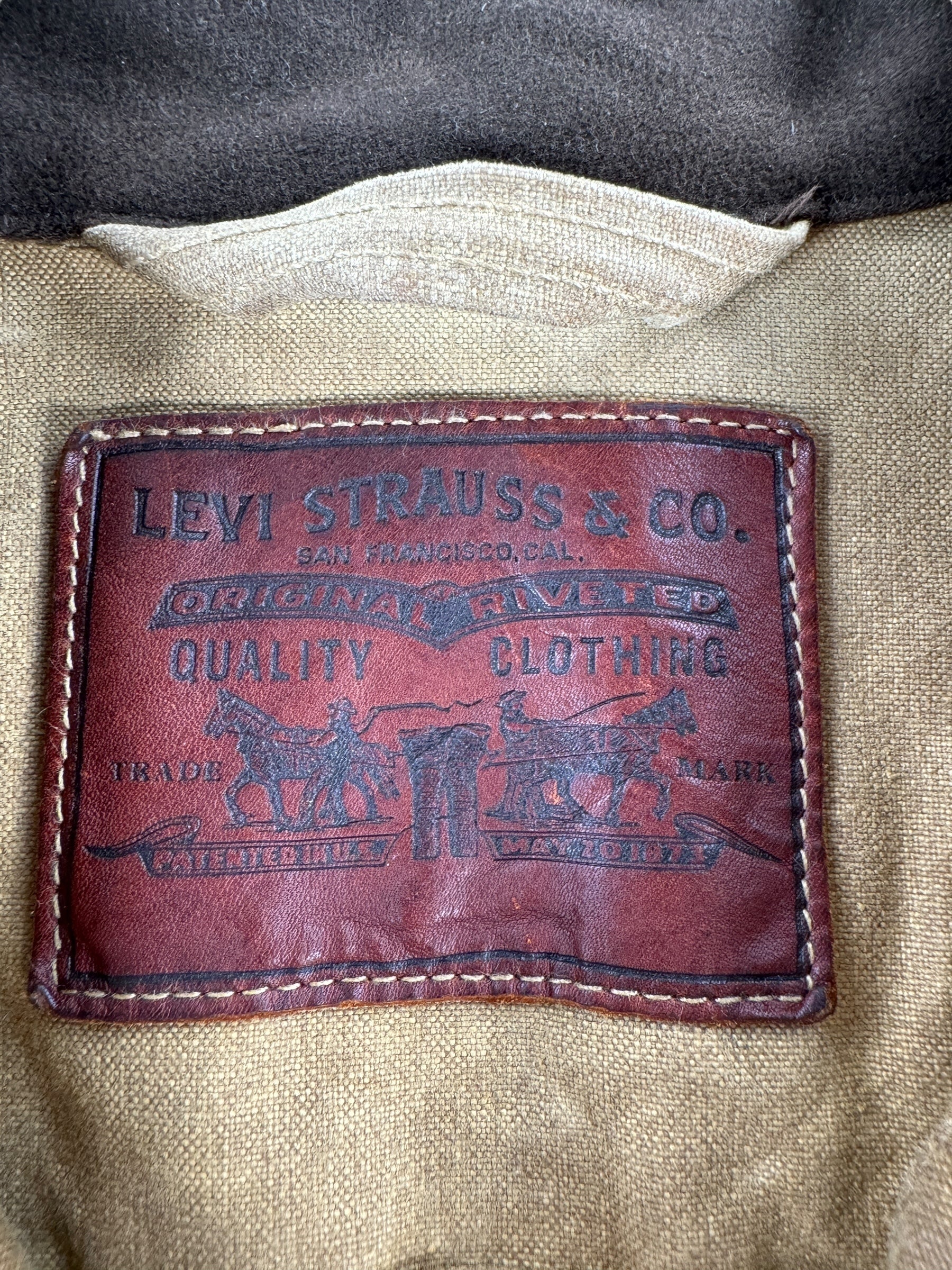 Tag on Modern FIlson X Levis Tan Trucker Jacket SZ XL