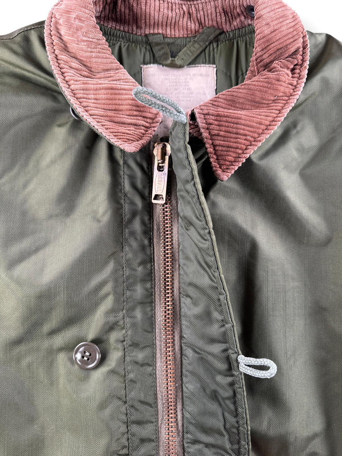 Button closure on Vintage 70’s Extreme Cold Weather Insulated Military Jacket SZ L