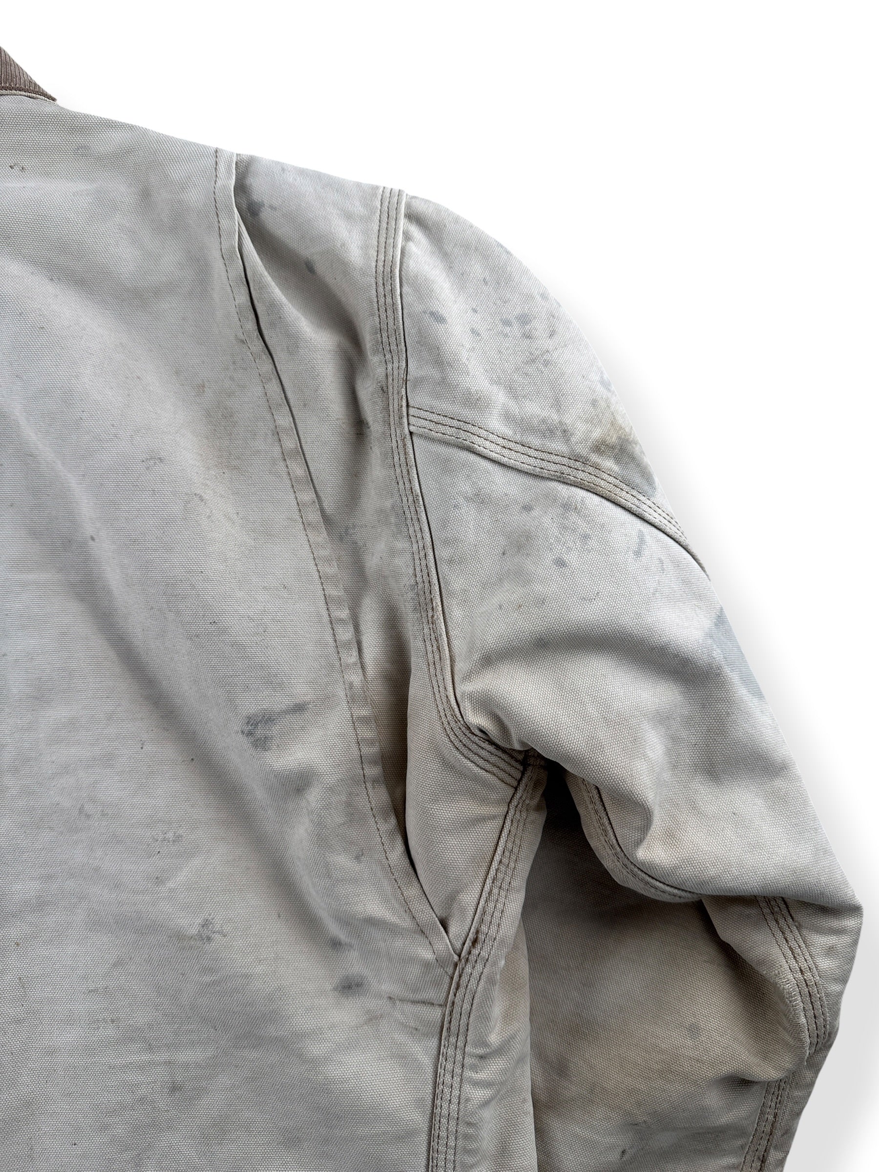 Ware on shoulder of Vintage 90’s Carhartt Faded Tan Detroit Jacket SZ XL