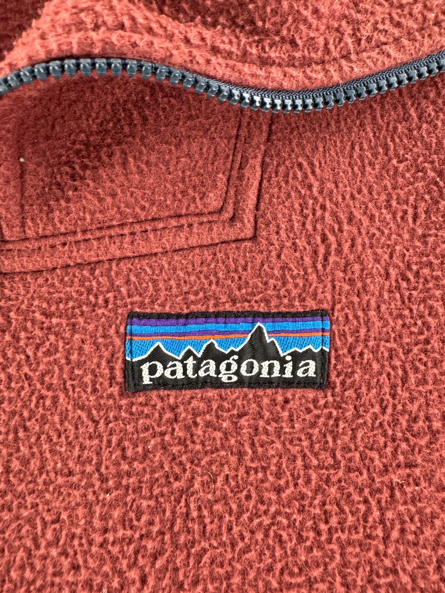 Label on Vintage Patagonia Light Red Synchilla Zip Up Jacket SZ L