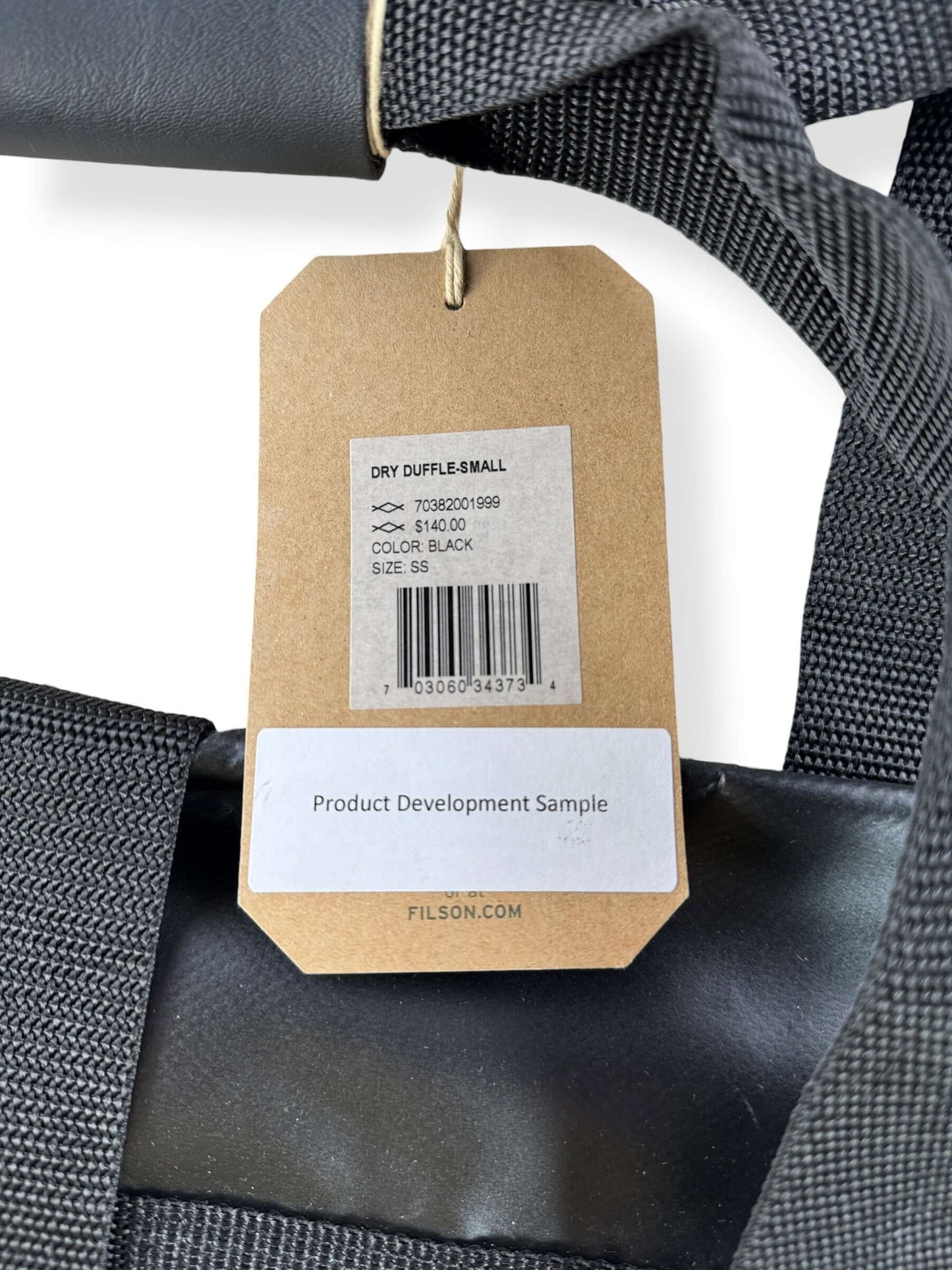 Back of original price tags on Filson Dry Duffel Small Design Production Sample