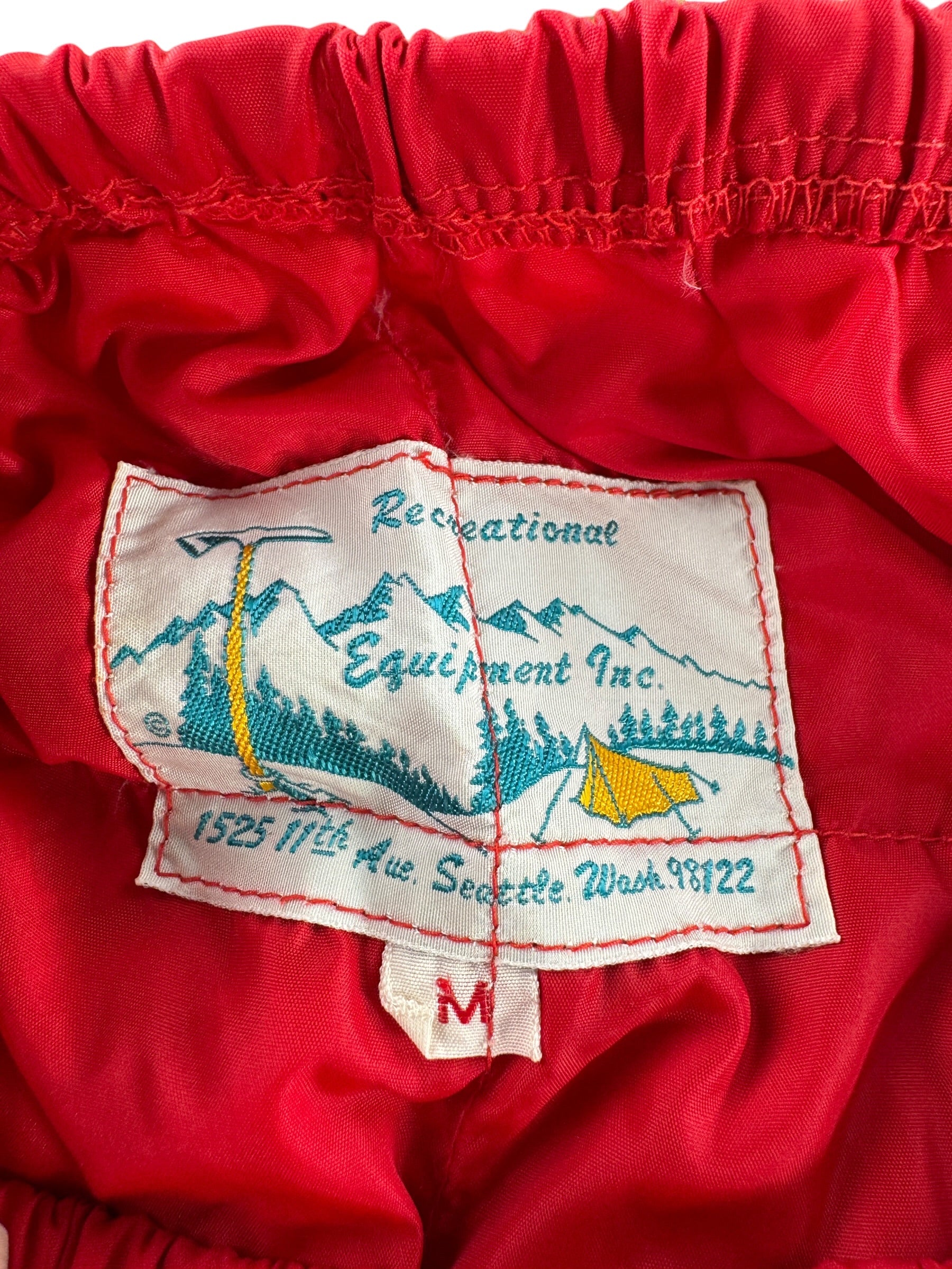 Label on Vintage REI Red Down Trousers SZ M