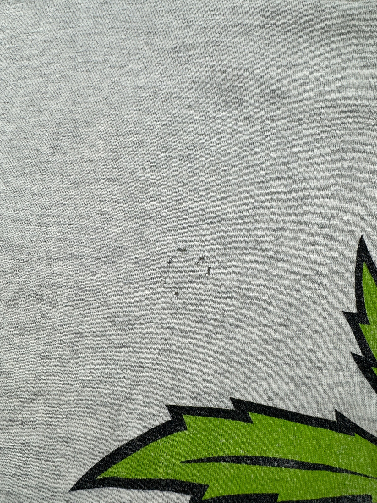 Small hole on back of Vintage Nature's Finest Weed Tee SZ XL - AS IS