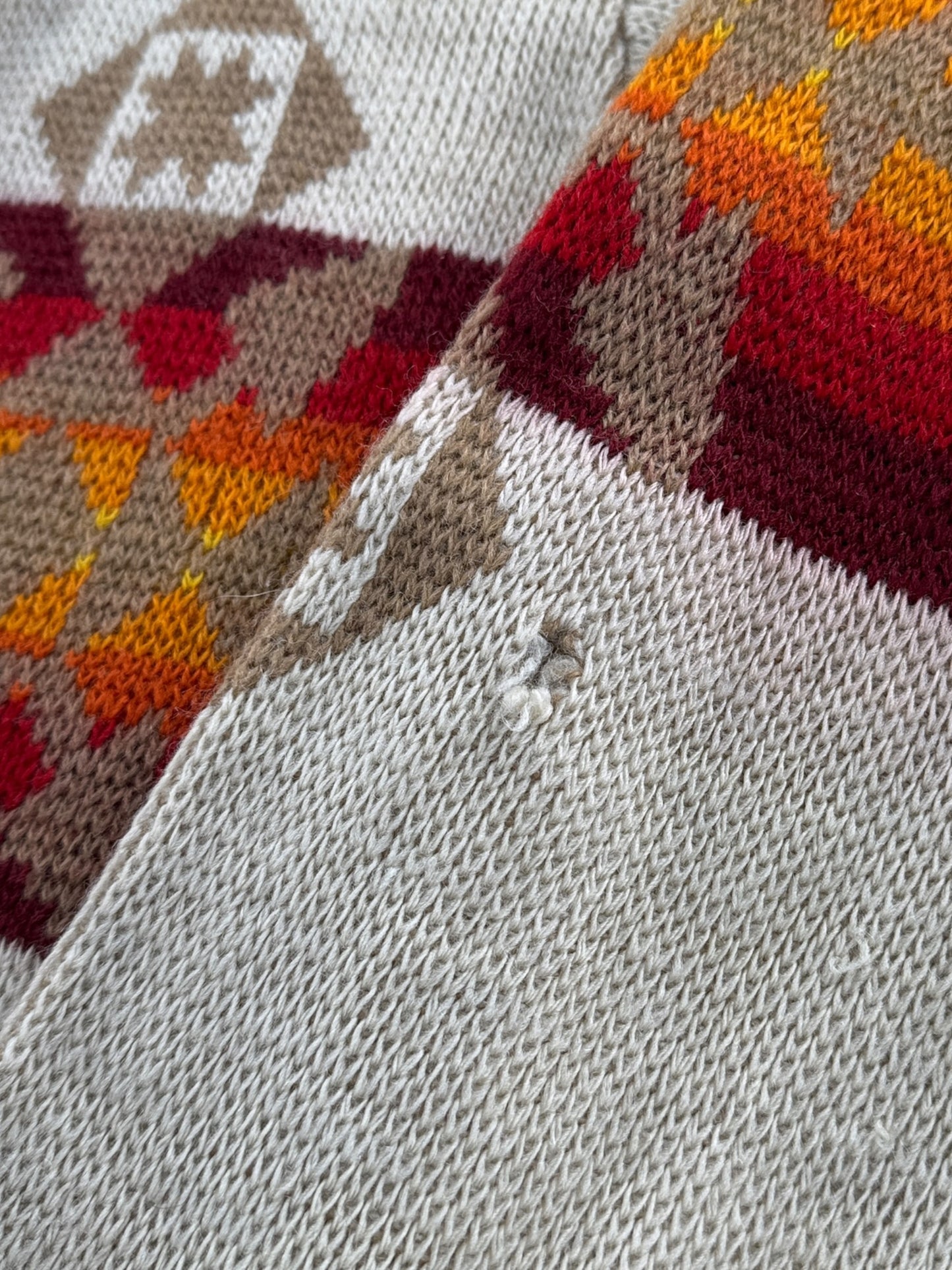 Hole on left sleeve of Vintage 70’s Pendleton Aztec Shawl Collar Cardigan SZ M