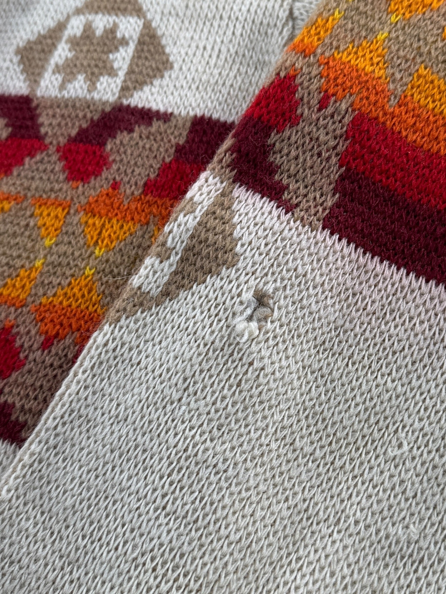 Hole on left sleeve of Vintage 70’s Pendleton Aztec Shawl Collar Cardigan SZ M