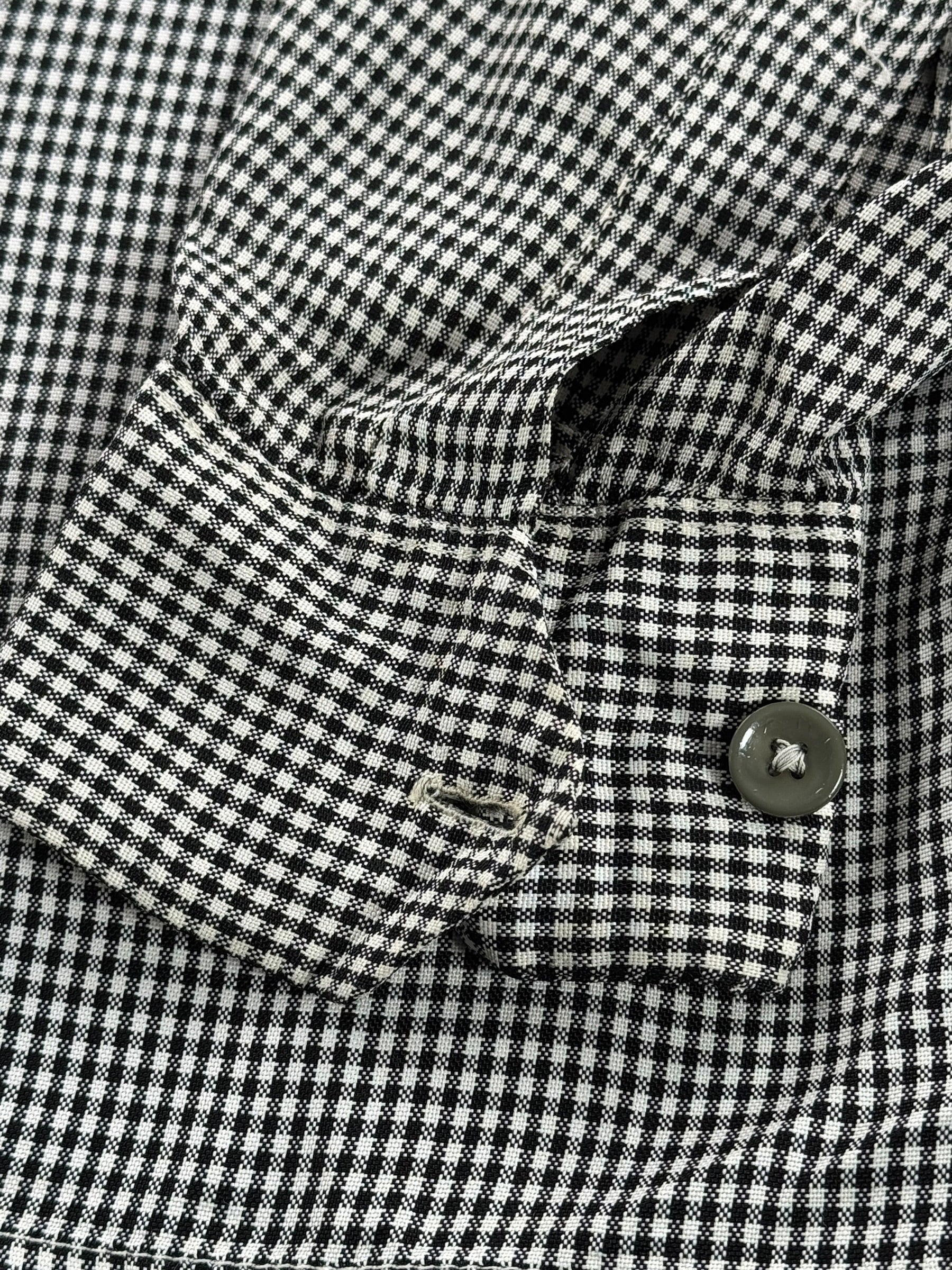 Missing button on oposite cuff of Vintage 1950s Sterling Black and White Rayon Loop Collar Shirt SZ M