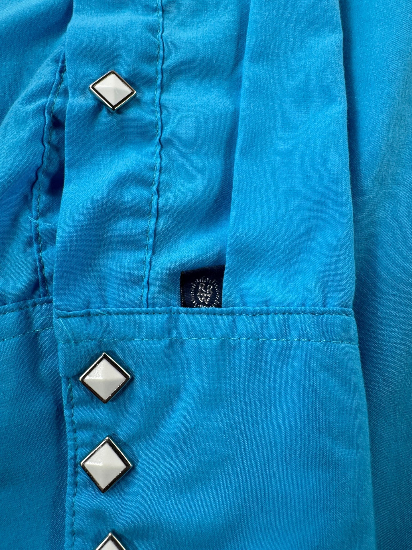 Label on Vintage Rockmount Electric Blue Pearl Snap SZ L