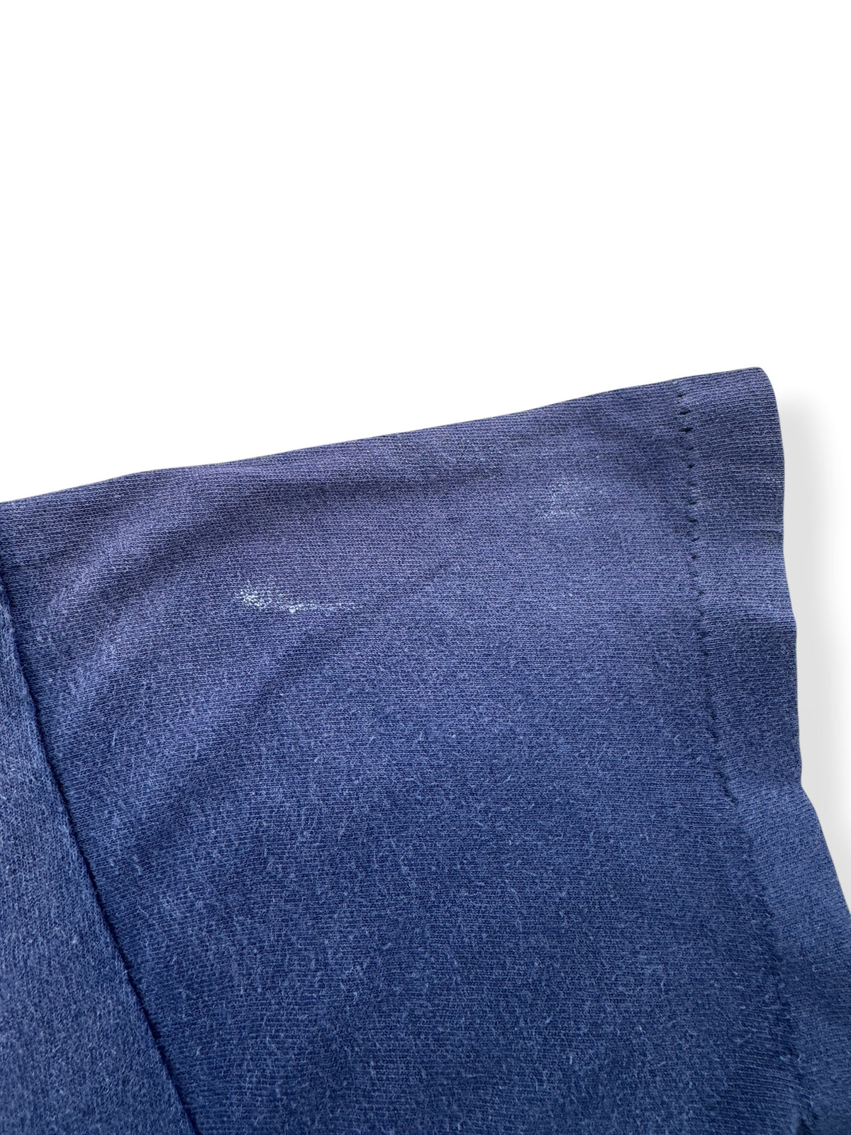 Fading on sleeve of Vintage Navy Ghost Pocket Tee SZ M
