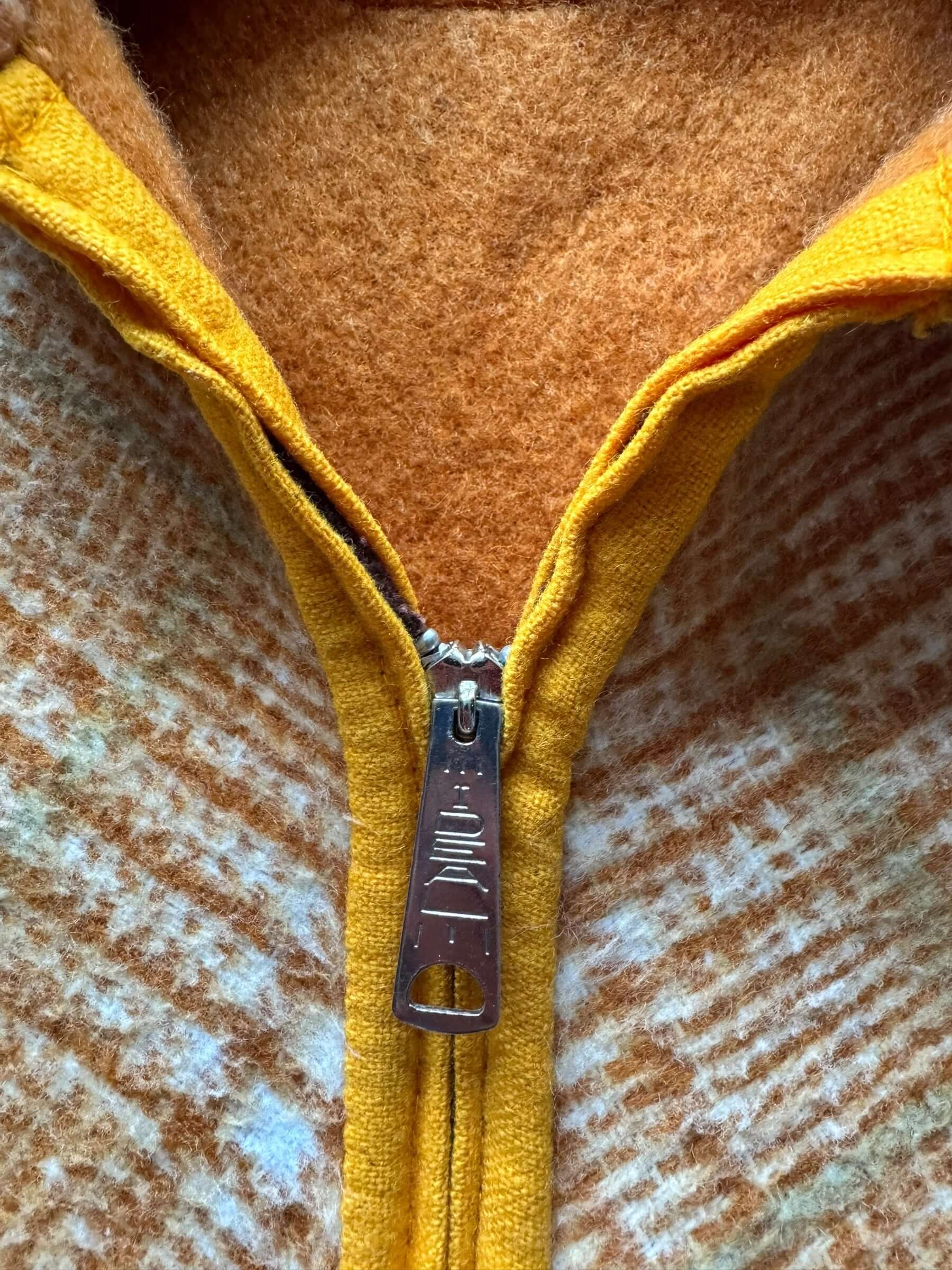 Zipper pull view of 1960s Reversible Wool Cape S-XL