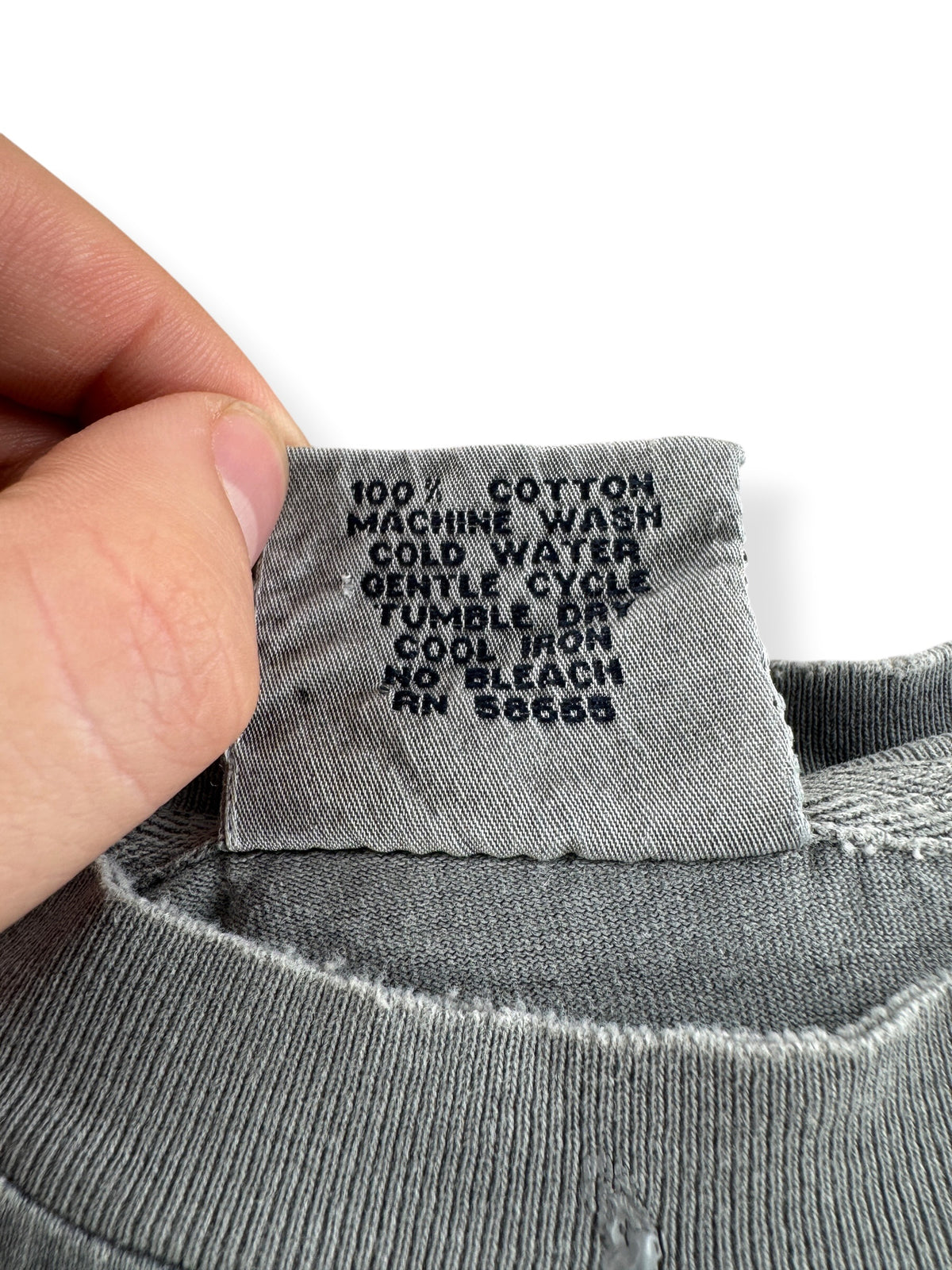 Back of tag on Vintage Pure Stuff Painted Blank Tee SZ XL
