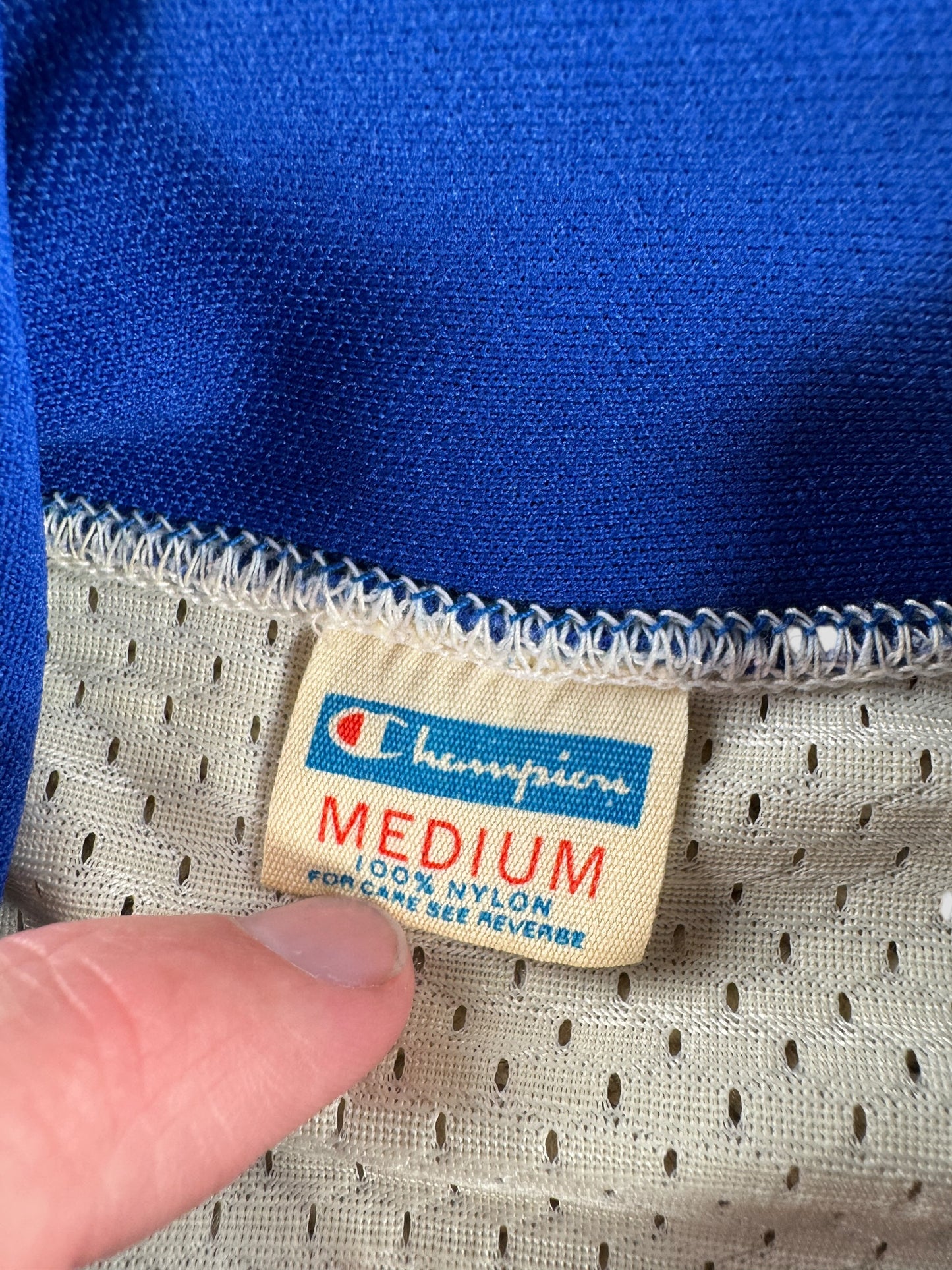 Tag on Vintage Champion Blue Bar Patriots Basketball Jersey SZ M