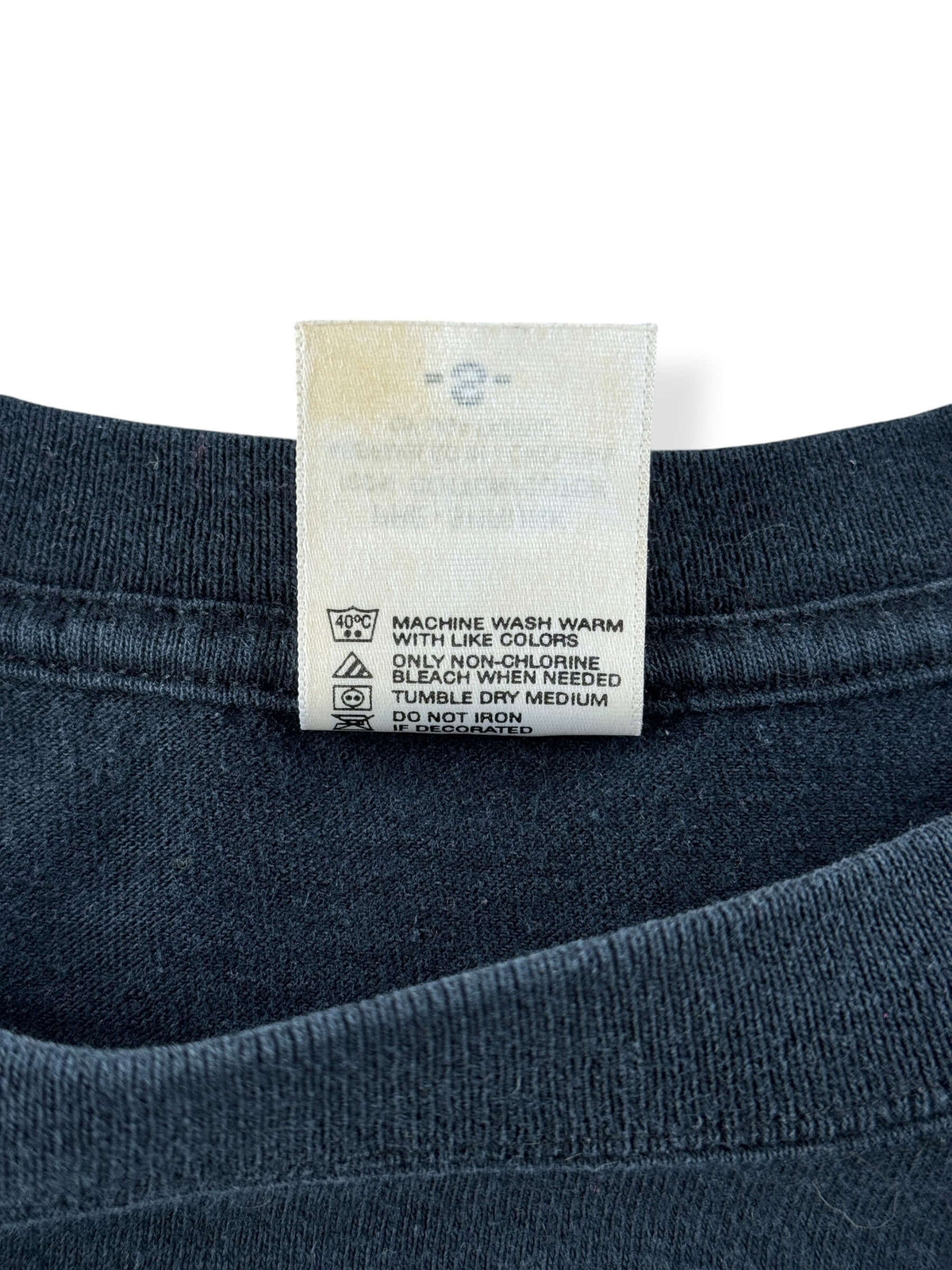 Back of tag on Vintage Emperor Band Tee SZ S