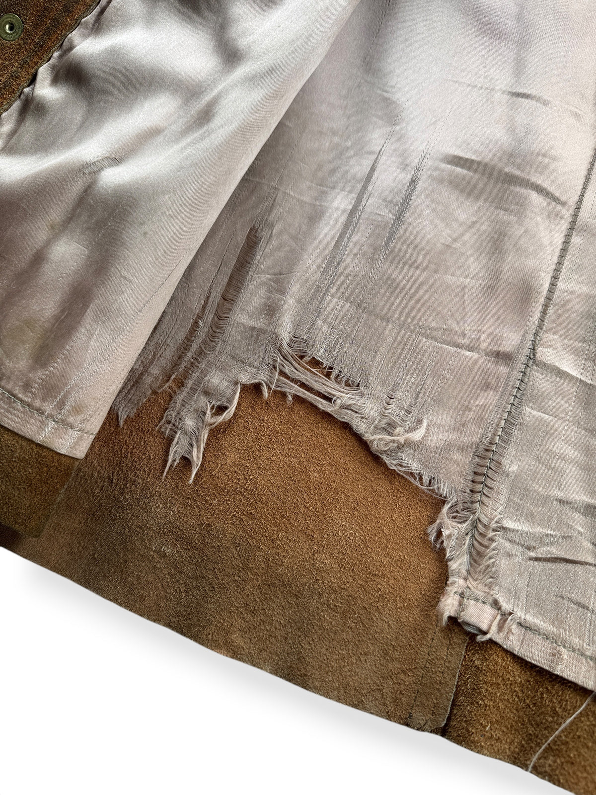 Tearing on inner lining of Vintage Fringe Suede Jacket SZ 40