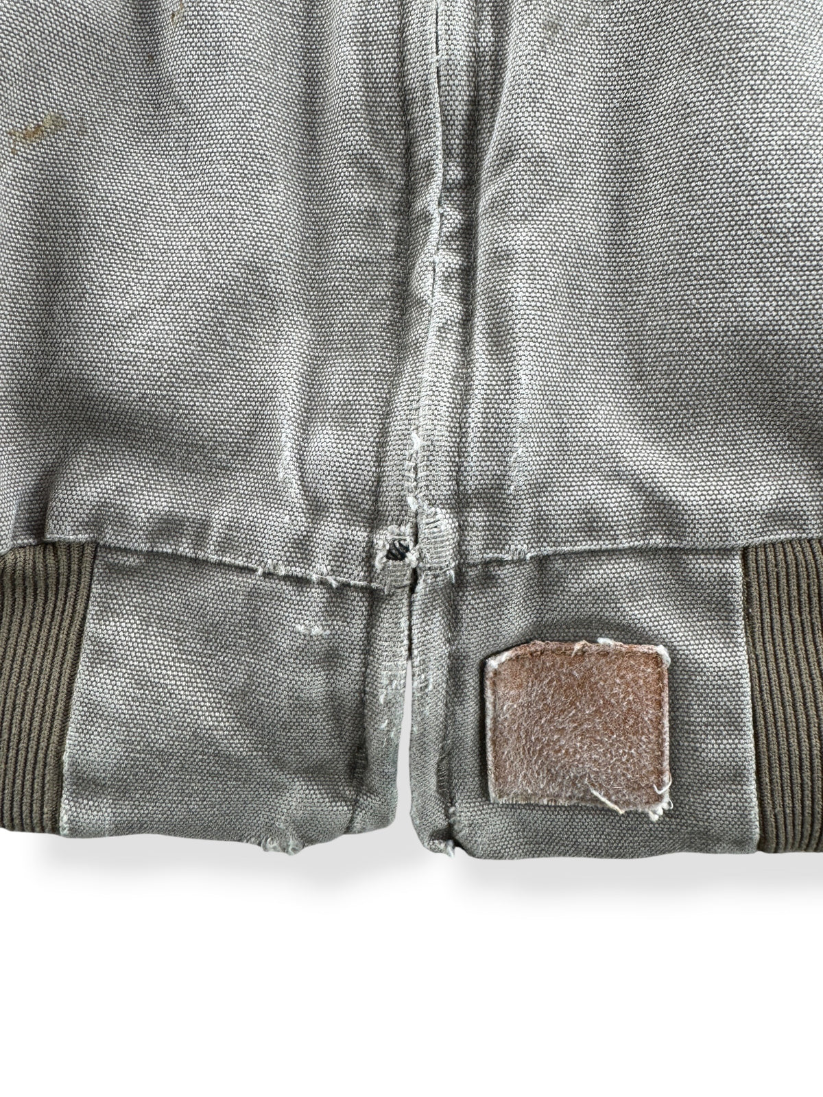Wear near hem on Vintage Distressed Carhartt Work Jacket SZ XL
