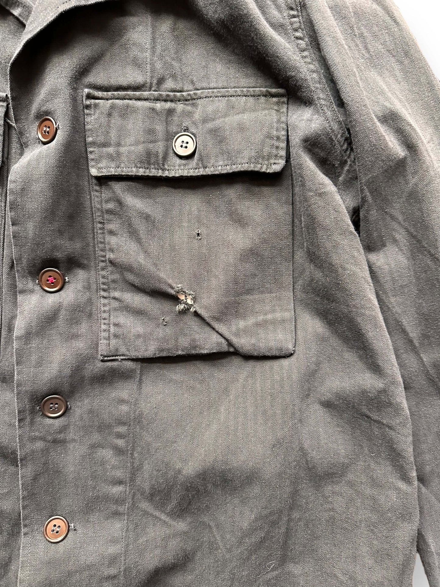 Small Hole in Upper Left Breast Pocket on Black Overdyed & Hand Repaired HBT Jacket SZ L