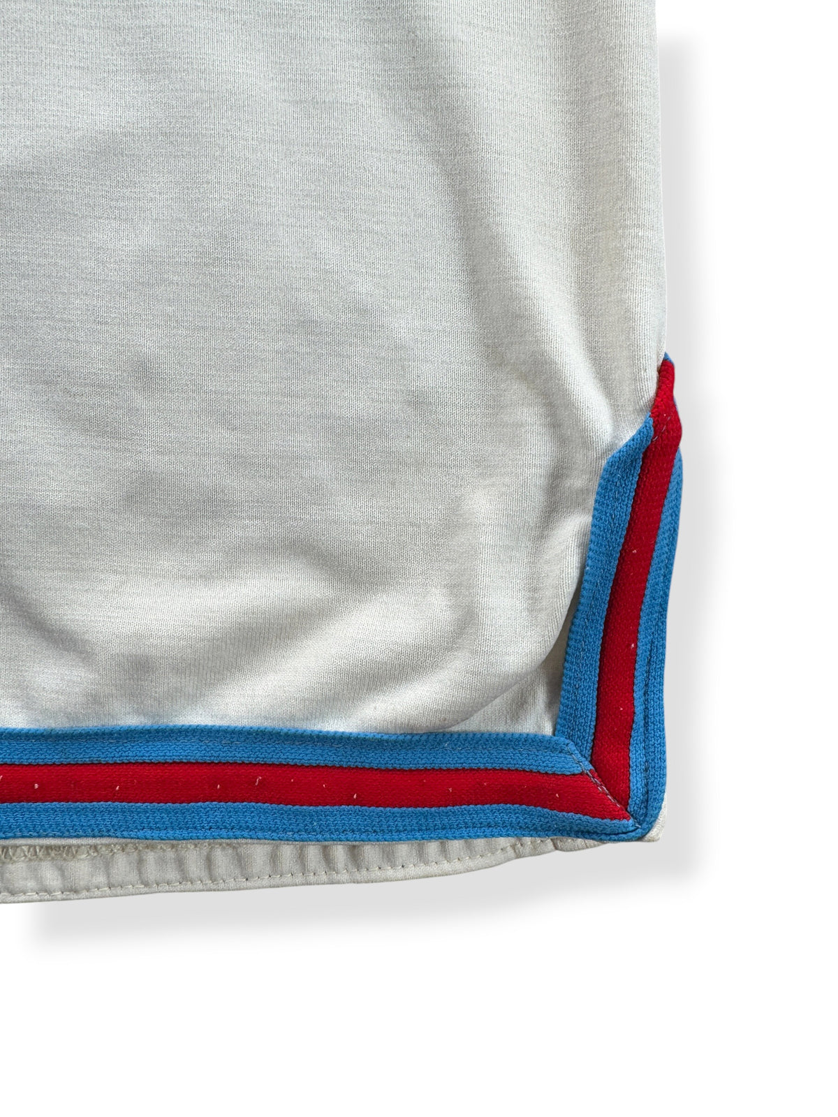 Ribbing detail on bottom hem of Vintage Athletic Supply Sealth Jersey SZ 44