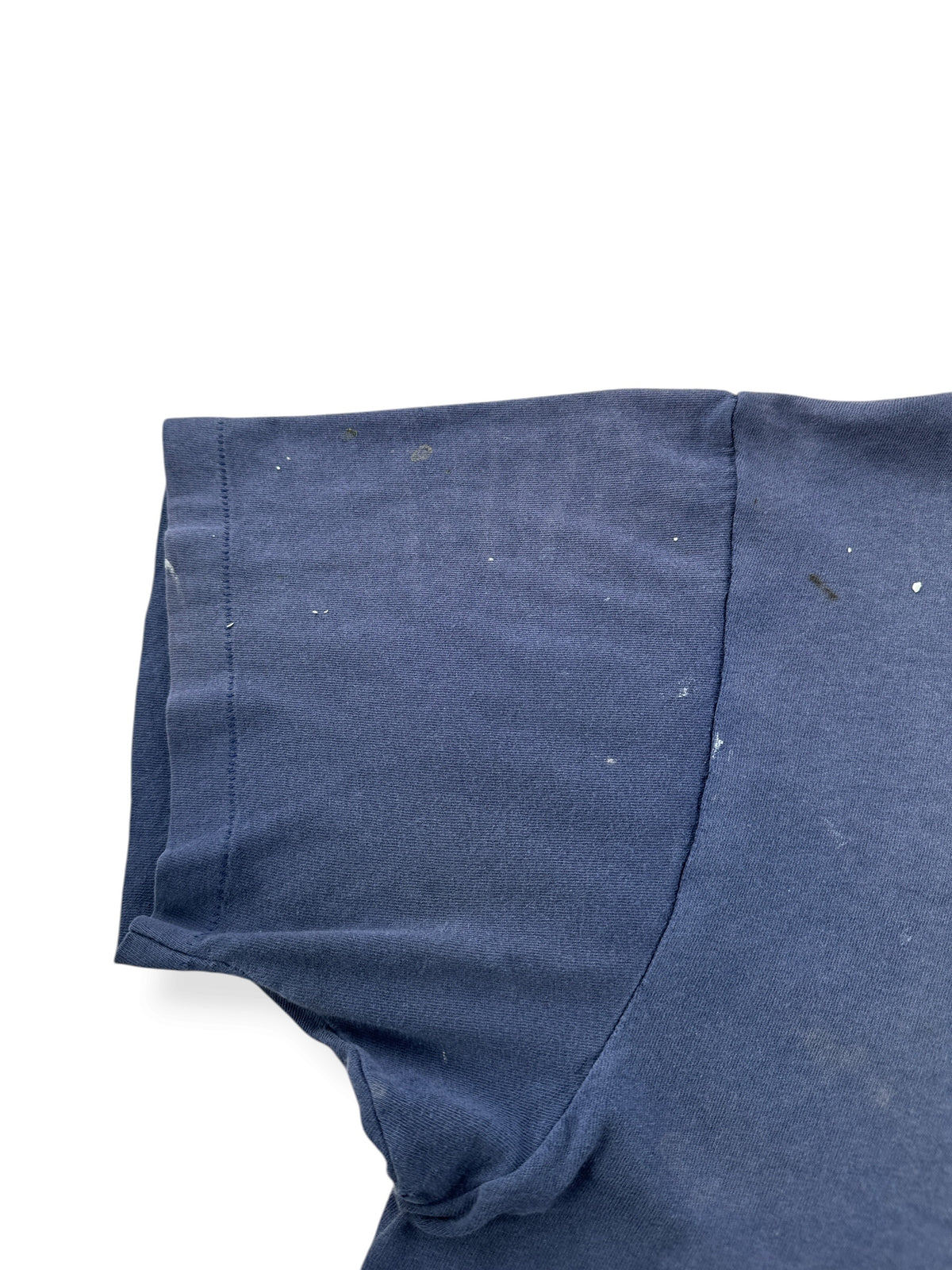 Paint on sleeve of Vintage Distressed Navy Blue Pocket Tee SZ L