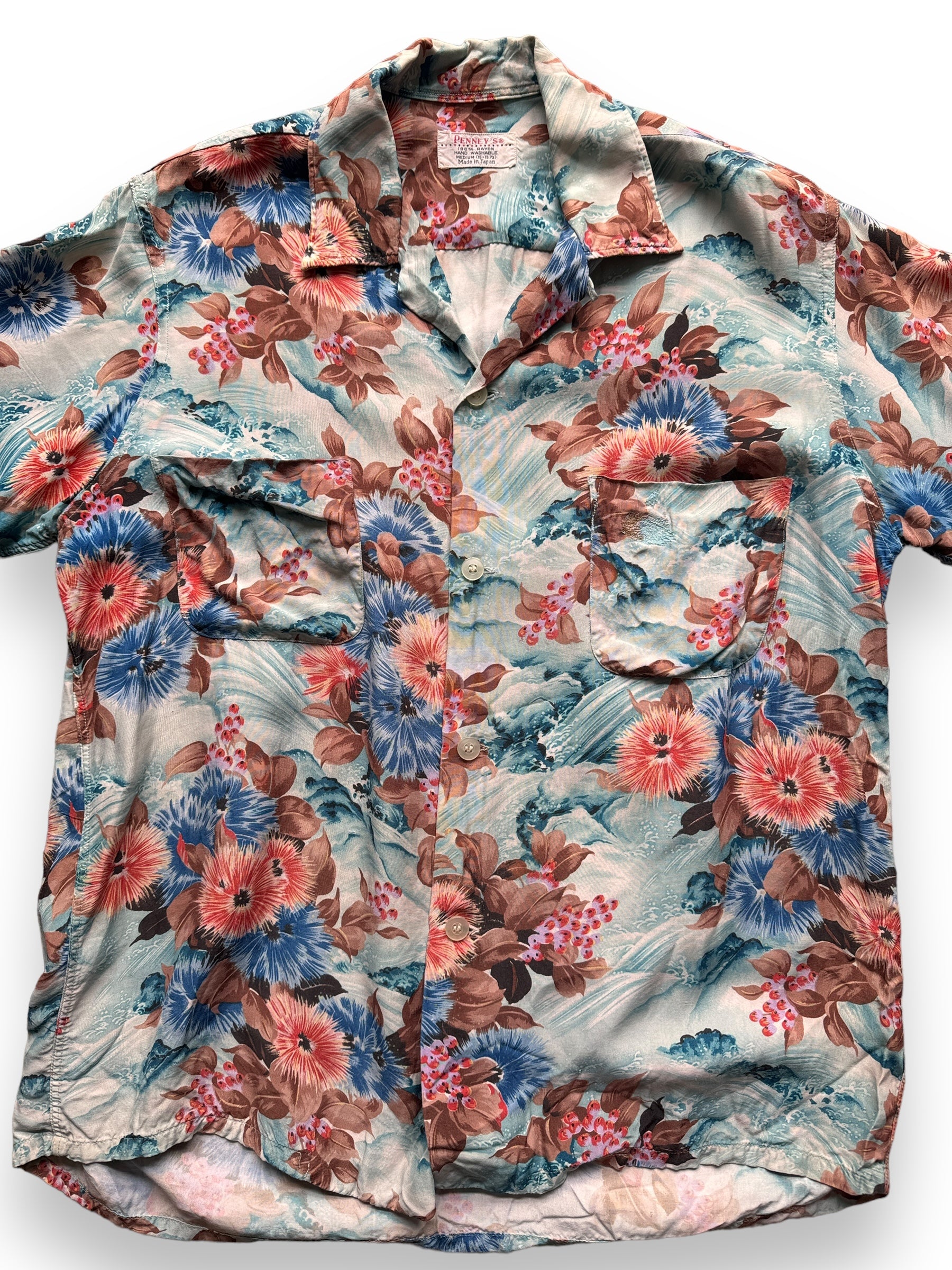 front close up of Vintage Made in Japan Blue/Pink Floral Penney's Aloha Shirt w/ Repairs SZ M