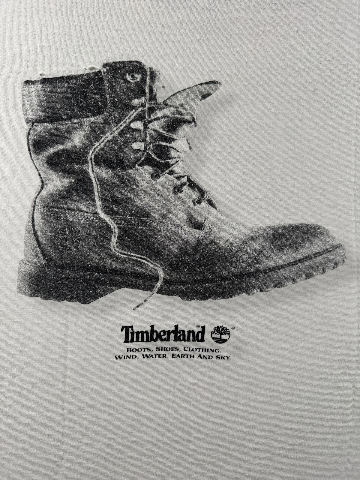Back graphic on Vintage Thrashed Give Racism The Boot Timberland Tee SZ XL