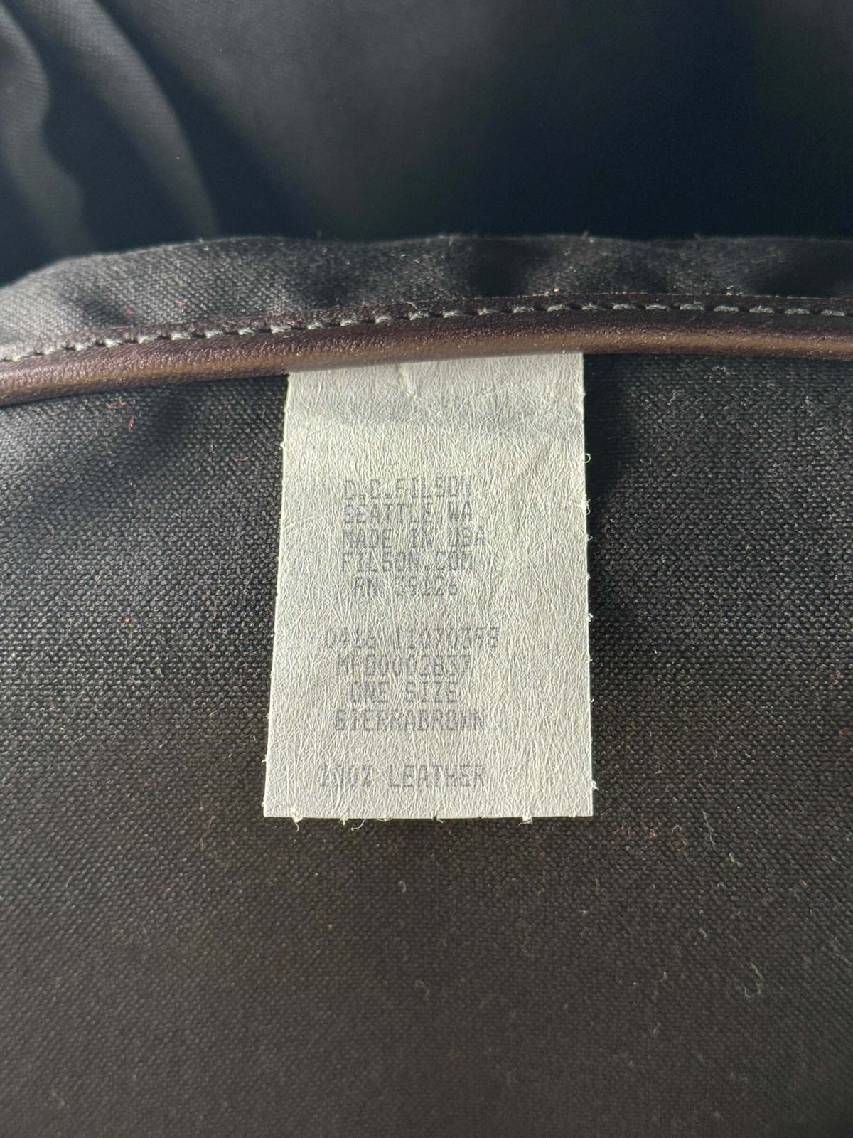 Filson production tag on Filson Weatherproof Sierra Brown Leather Journeyman Backpack