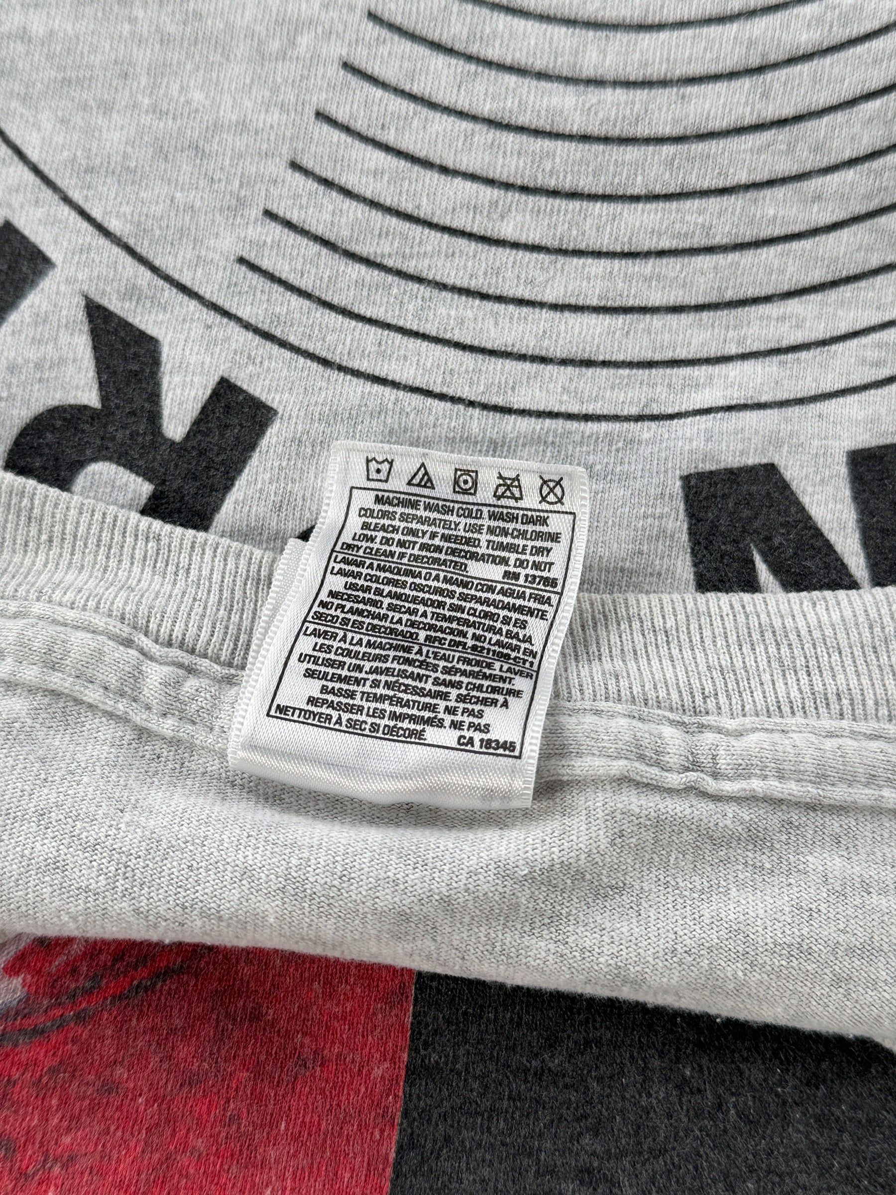 Backside of other tag on Vintage John Prine Souvenirs Tour Shirt SZ XL