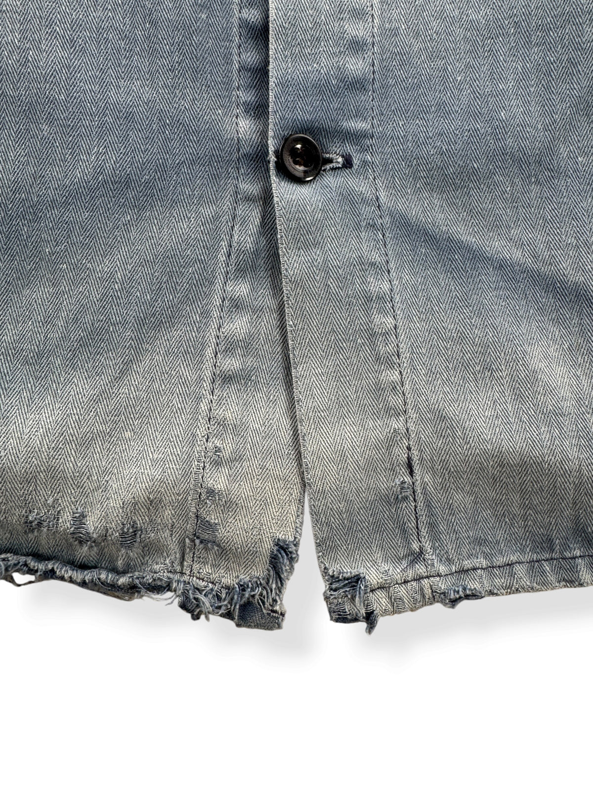 Ware on bottom hem of Vintage Distressed French Chore Coat SZ L