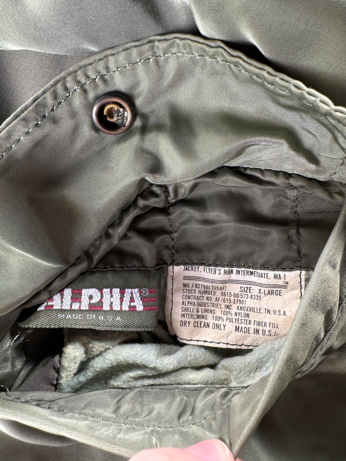 Label on Vintage Alpha Industries MA1 Bomber Jacket SZ XL