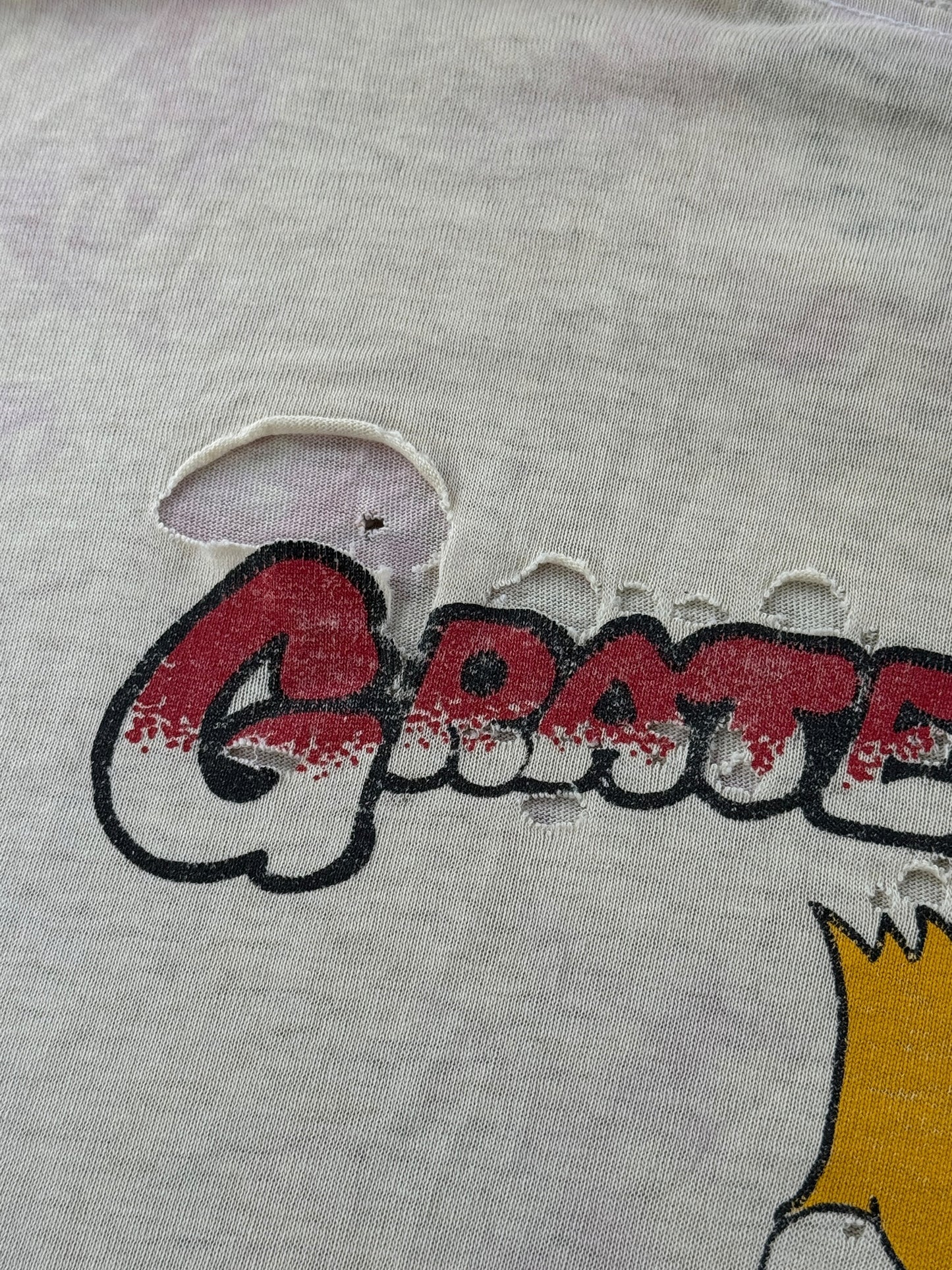 Damage on back of Vintage '90 Spring Tour Grateful Dead Bart Simpson Thrasher Tee SZ XL