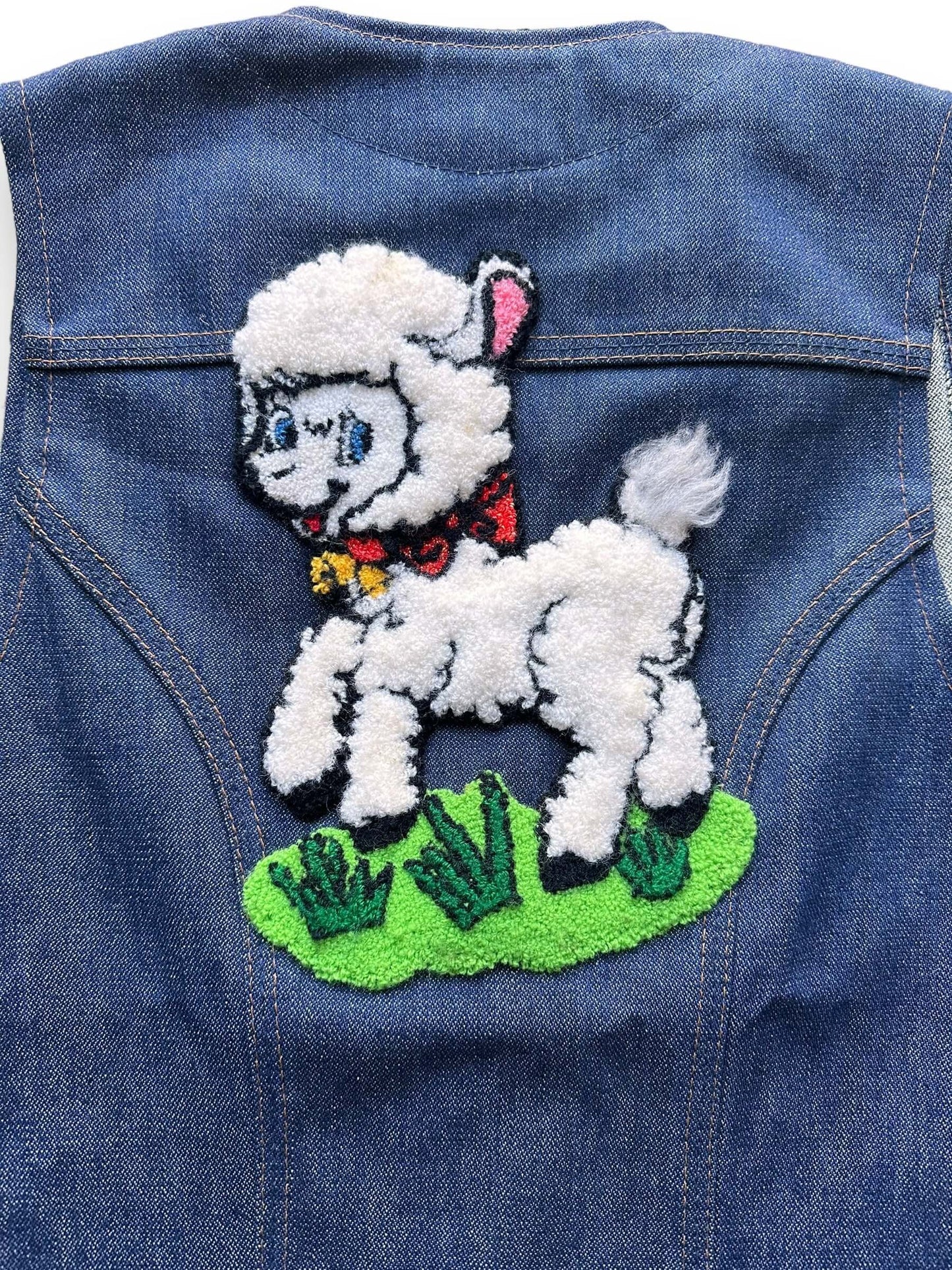 back close up of Vintage Wrangler Lamb Patch Denim Vest SZ S