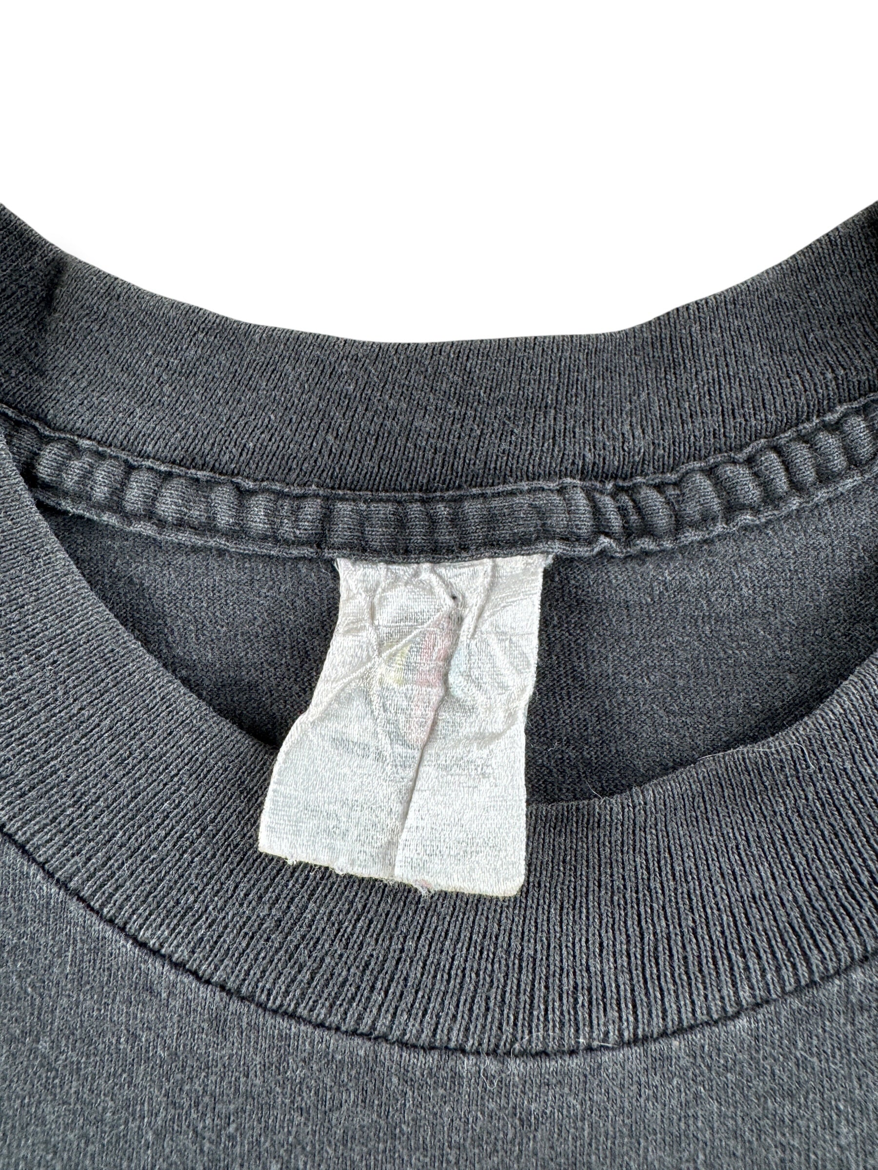 Close up of tag on Vintage Diana Ross Take Me Higher Tee