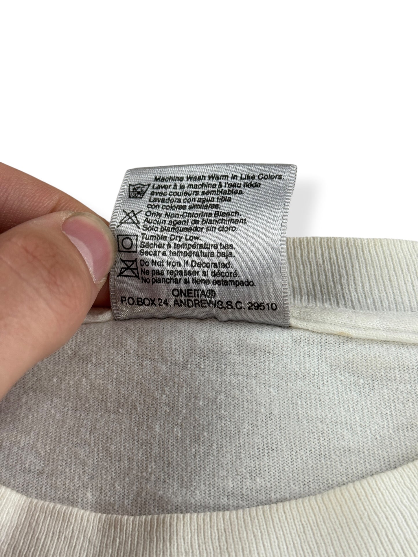 Back of tag on Vintage Buckaroo Brand Apples Cowboy Tee SZ XL