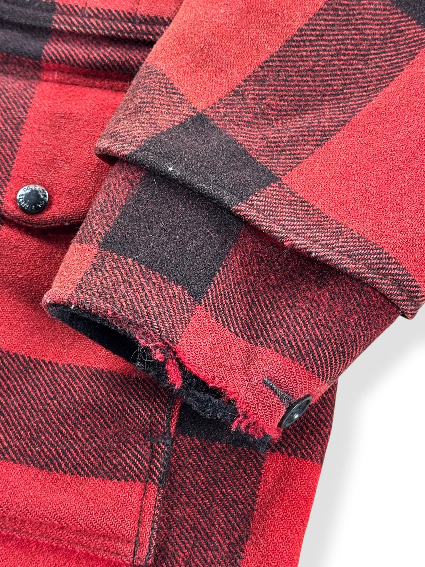 Ware on cuff of Vintage 80’s Filson Double Mackinaw SZ 44