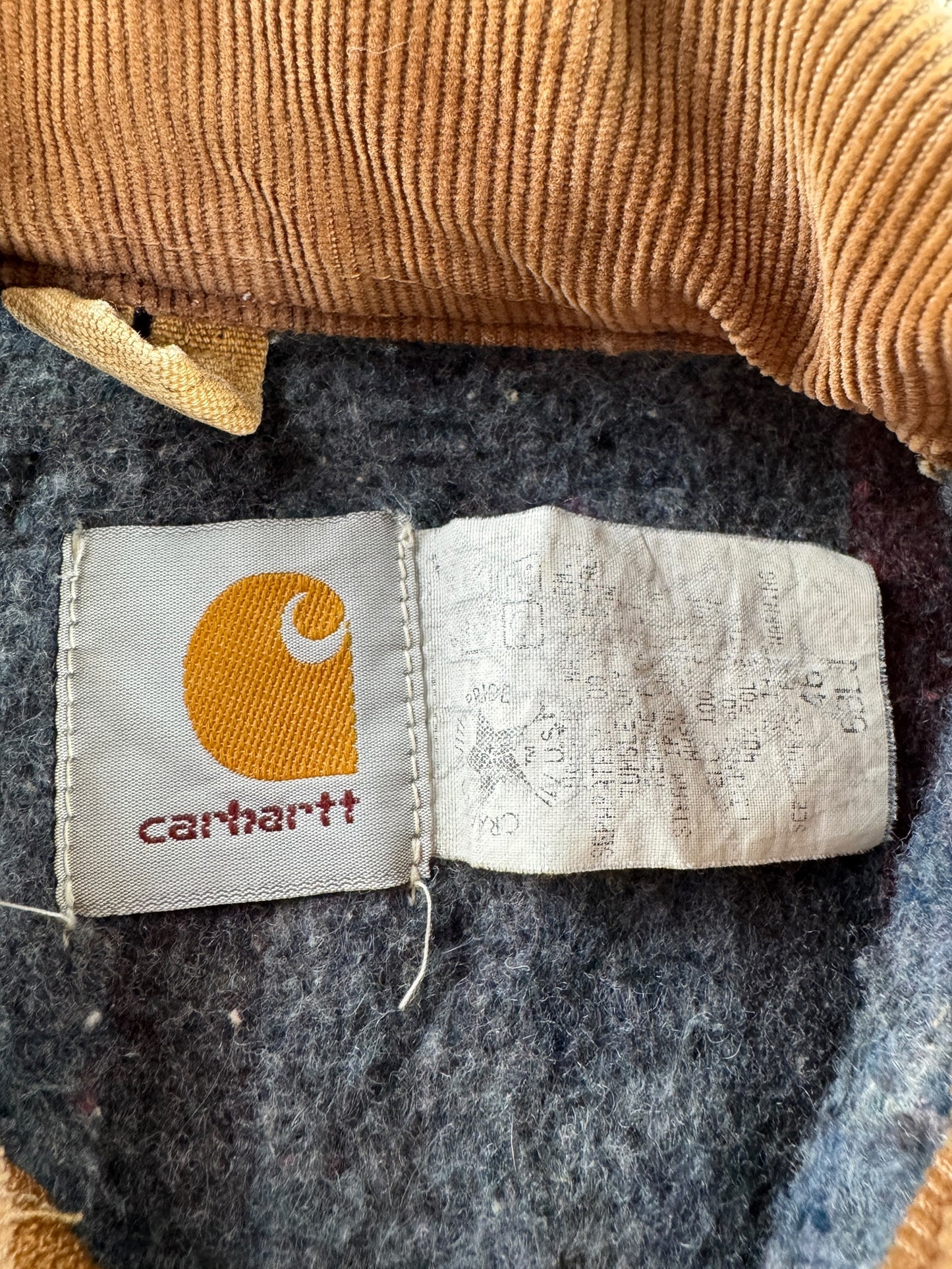 Label on Vintage Tan Carhartt Detroit Jacket SZ 46